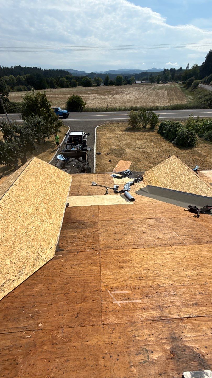 Residential Roof Replacement with Metal Accents by Orezona Building & Roofing Company, Inc.