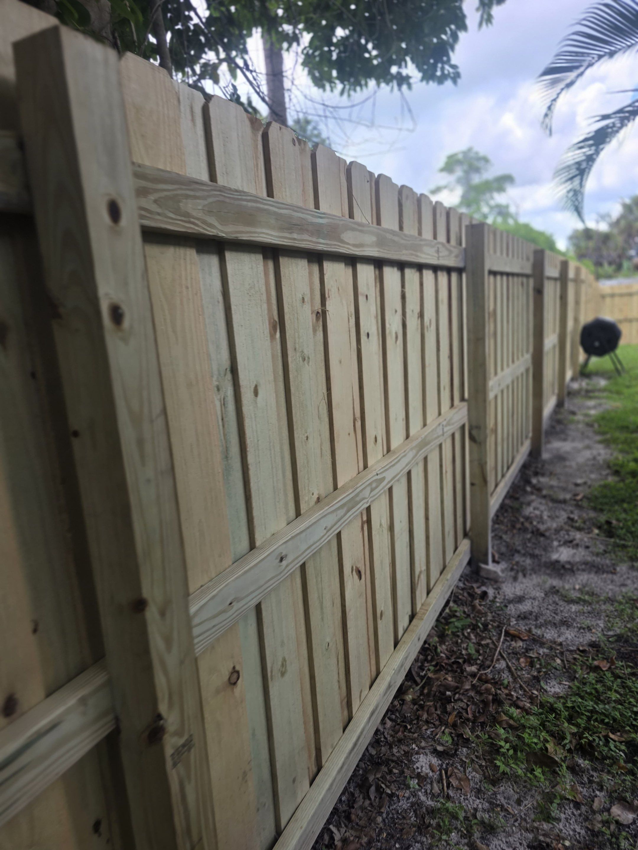 Wood Privacy Fence Installation with Double Gate in Port Charlotte by True Fence LLC