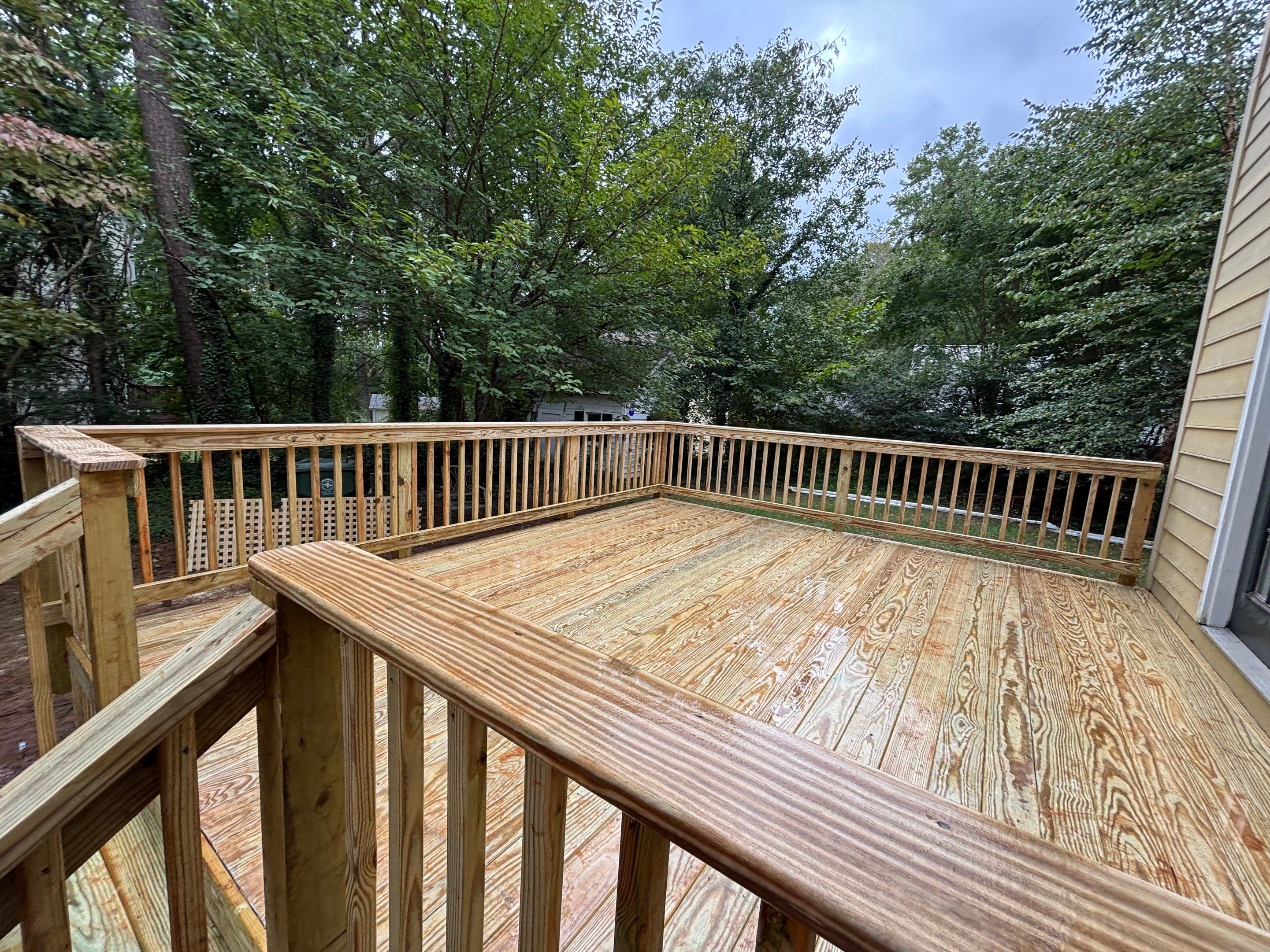 James Hardie Siding Replacement and Custom Deck Construction in Cary by The Remodeling Company