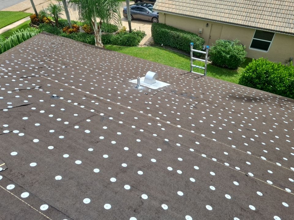 Residential Roofing Installation using 1" Nail strip metal roof by BLUES BROTHERS ROOFING