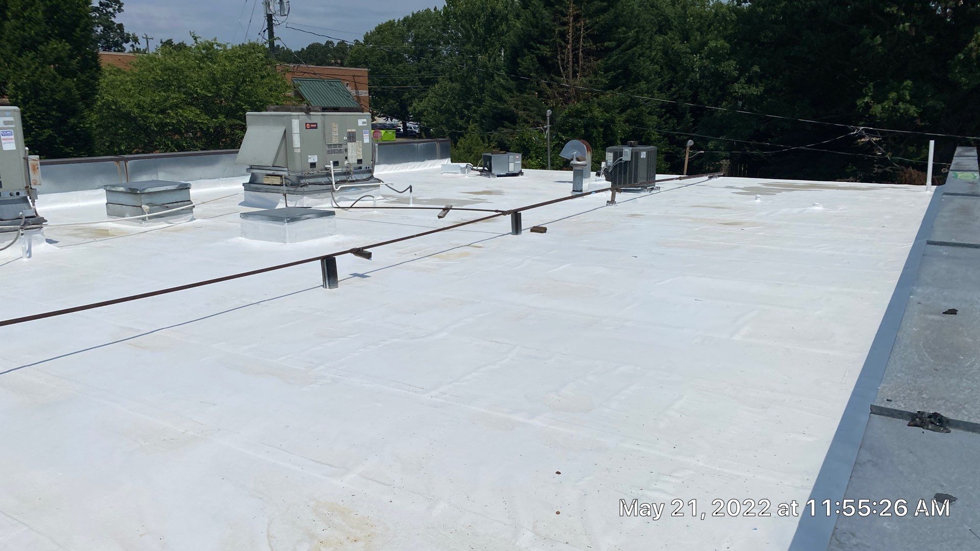 Commercial Roof Coating using Fiberseal basecoat and Silicon Topcoat by Just In Time Roofing and Restoration