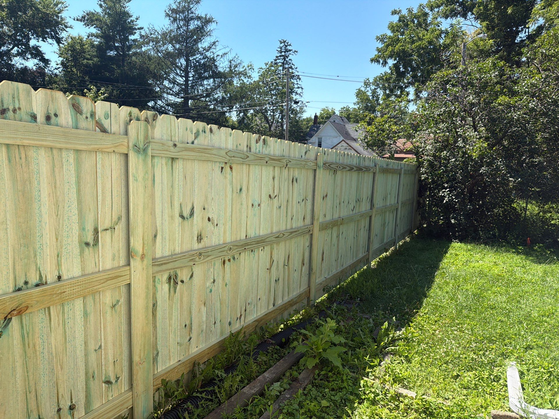 Pressure-Treated Wood Privacy Fence Installation in Waterloo by Perfect Picket Fence and Stain