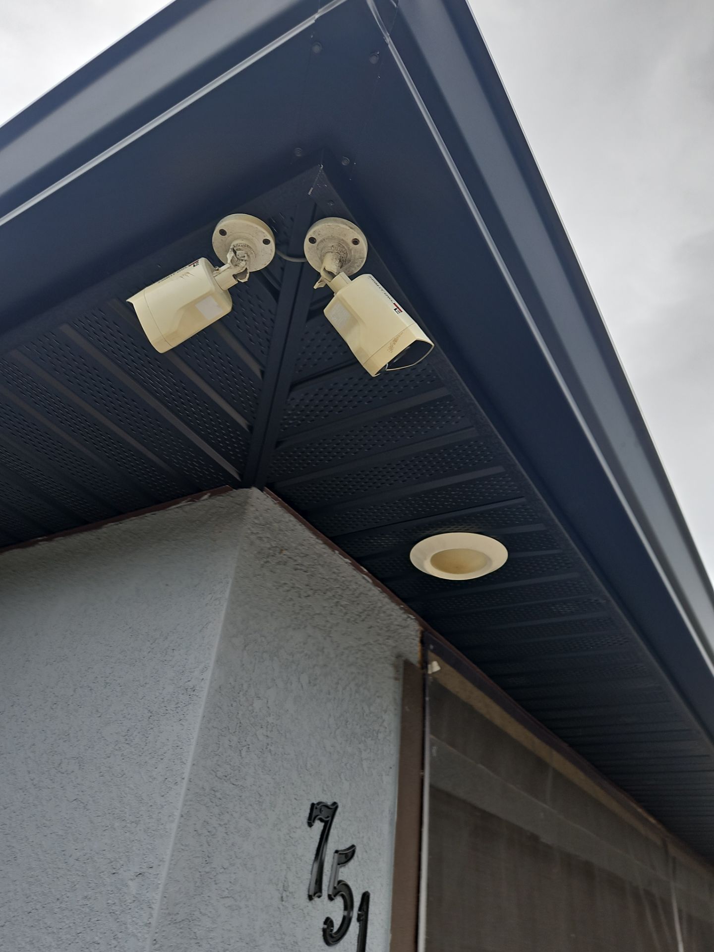 Black Seamless Gutters & Soffit/Fascia in Lehigh Acres FL by Gutter Professors