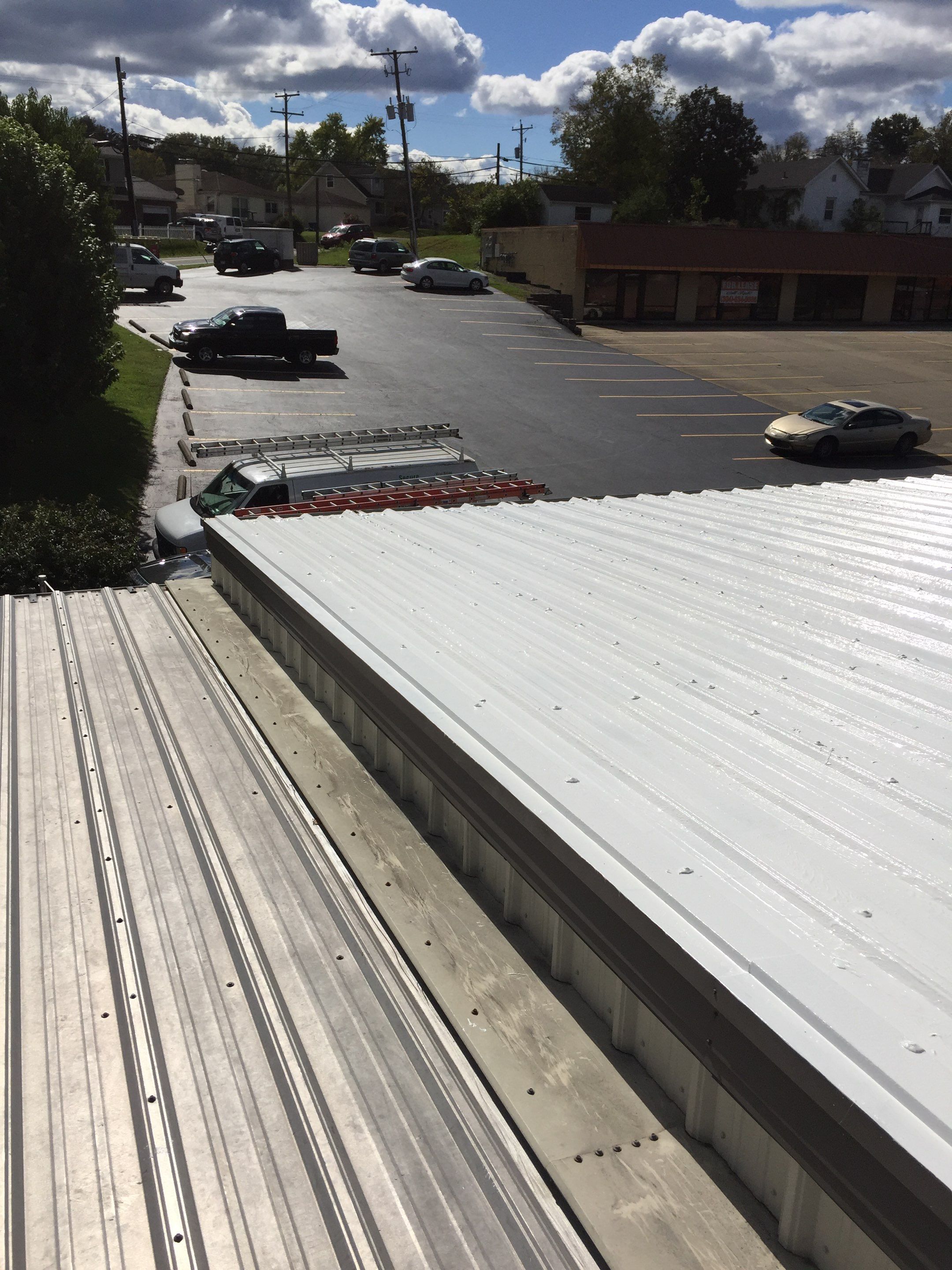 Commercial Roof Coating using Gaco Silicone Roof Coating by Secure Construction Company Inc