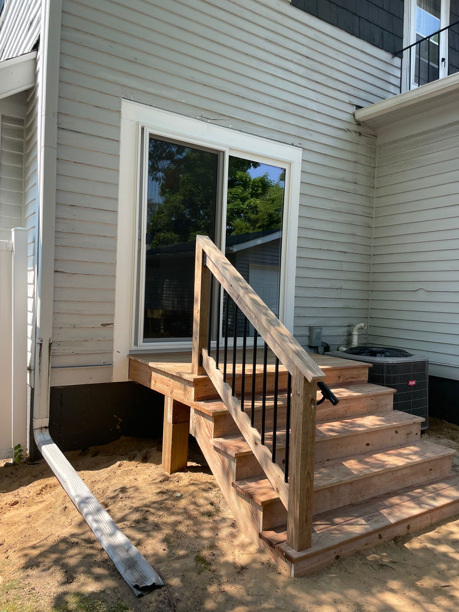 Patio Slider Door and Rear Deck  by Avalon Roofing and Exteriors