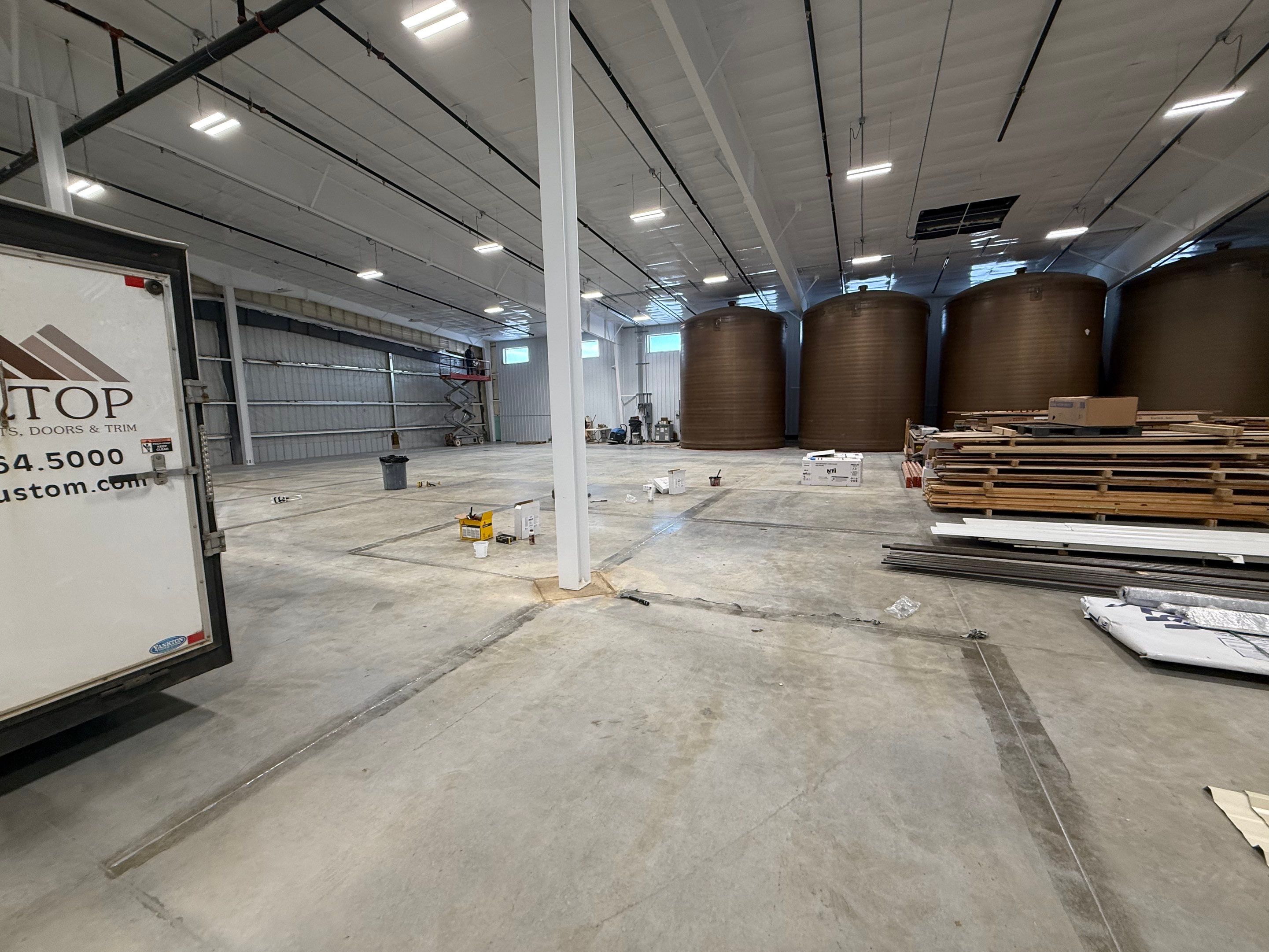 Industrial Concrete Polishing and Coating for Large Manufacturing Warehouse by Select Painting, Coatings & Garage Cabinets