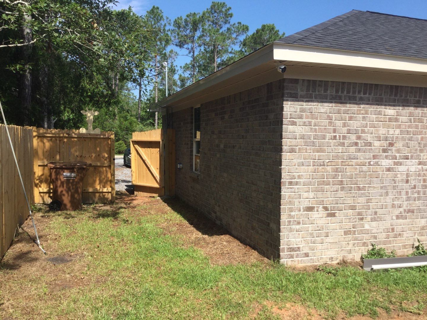Downspout Installation using White Down Spouts in Milton FL by Gutter Professors