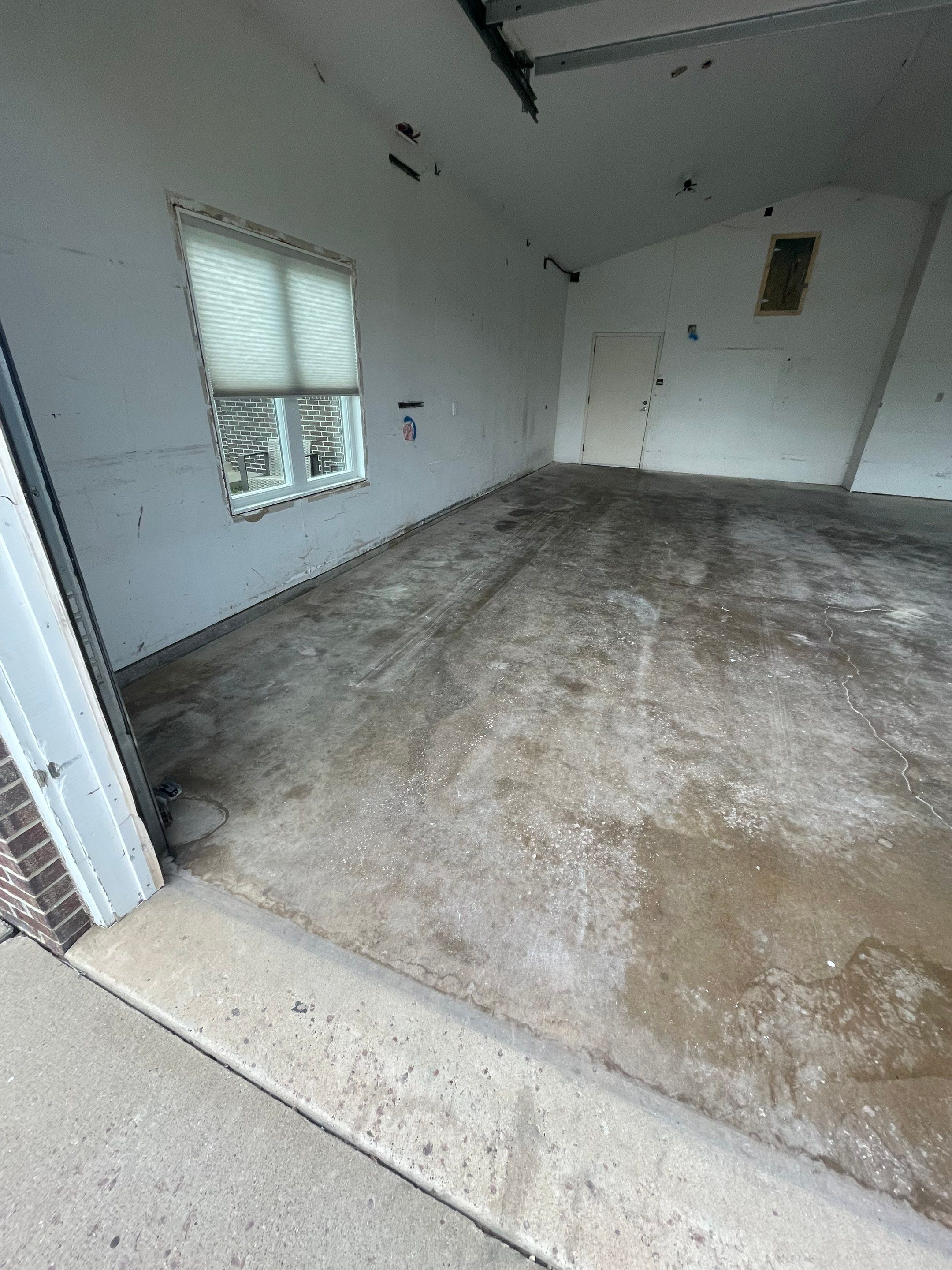 Coyote Flake Concrete Coating for Sioux Falls Garage by Select Painting, Coatings & Garage Cabinets