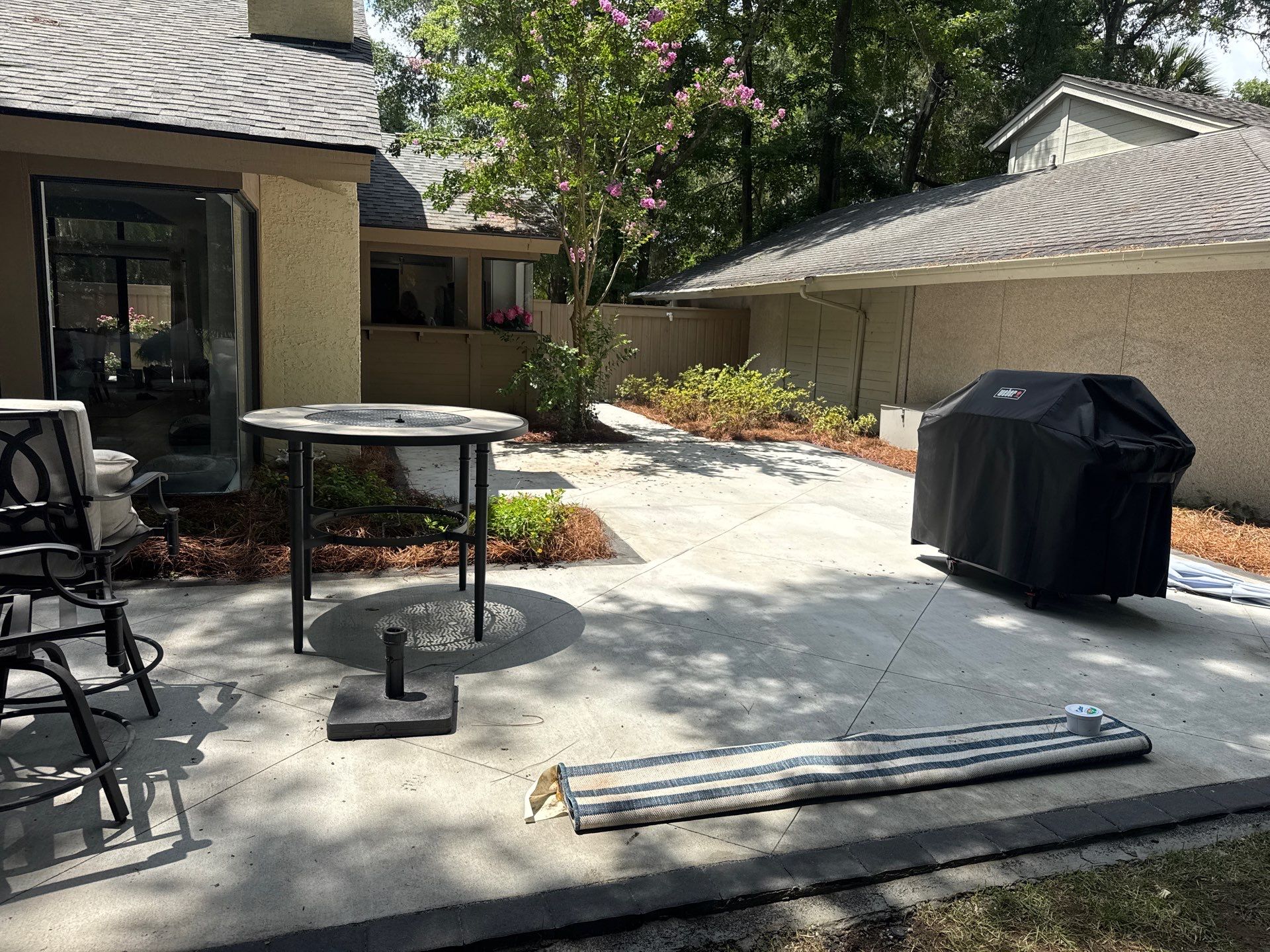 Custom Concrete Patio and Herringbone Paver Walkway in Hilton Head Island by Lowcountry Scapes, LLC