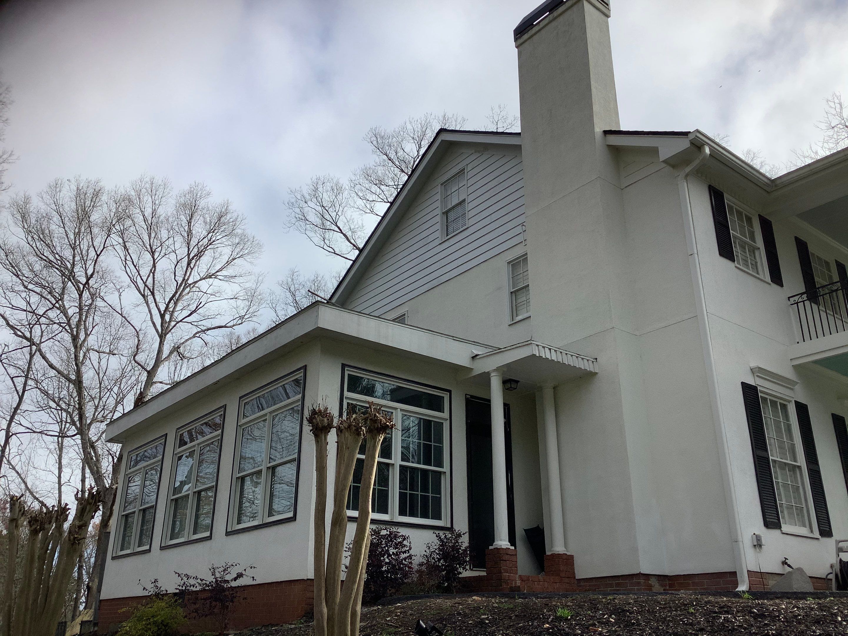 Full Exterior Repaint for Colonial Style Home in Cumming by Swift Home Renovations
