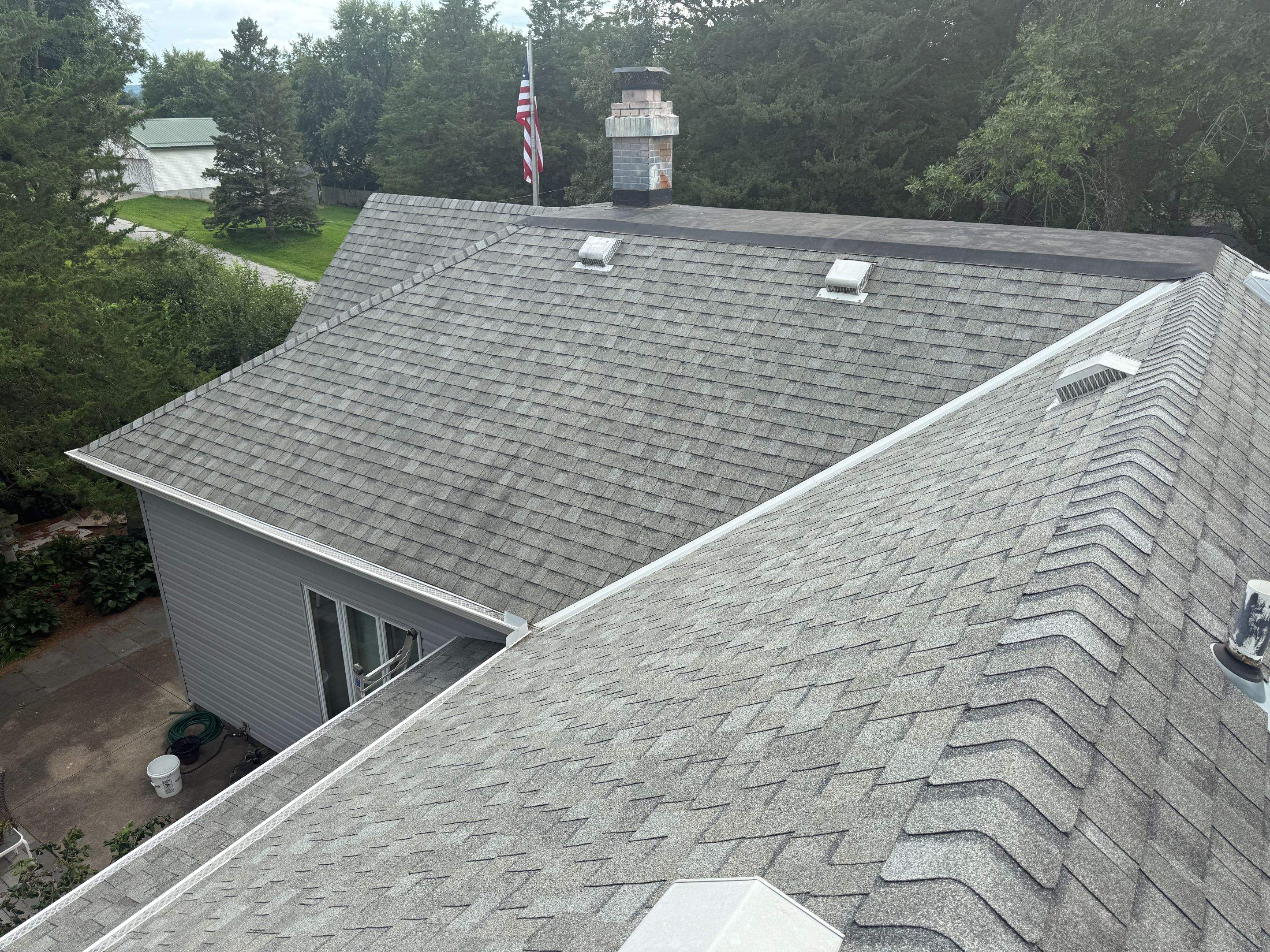 Asphalt Shingle and EPDM Membrane Roof Installation in Mineola by Star Home