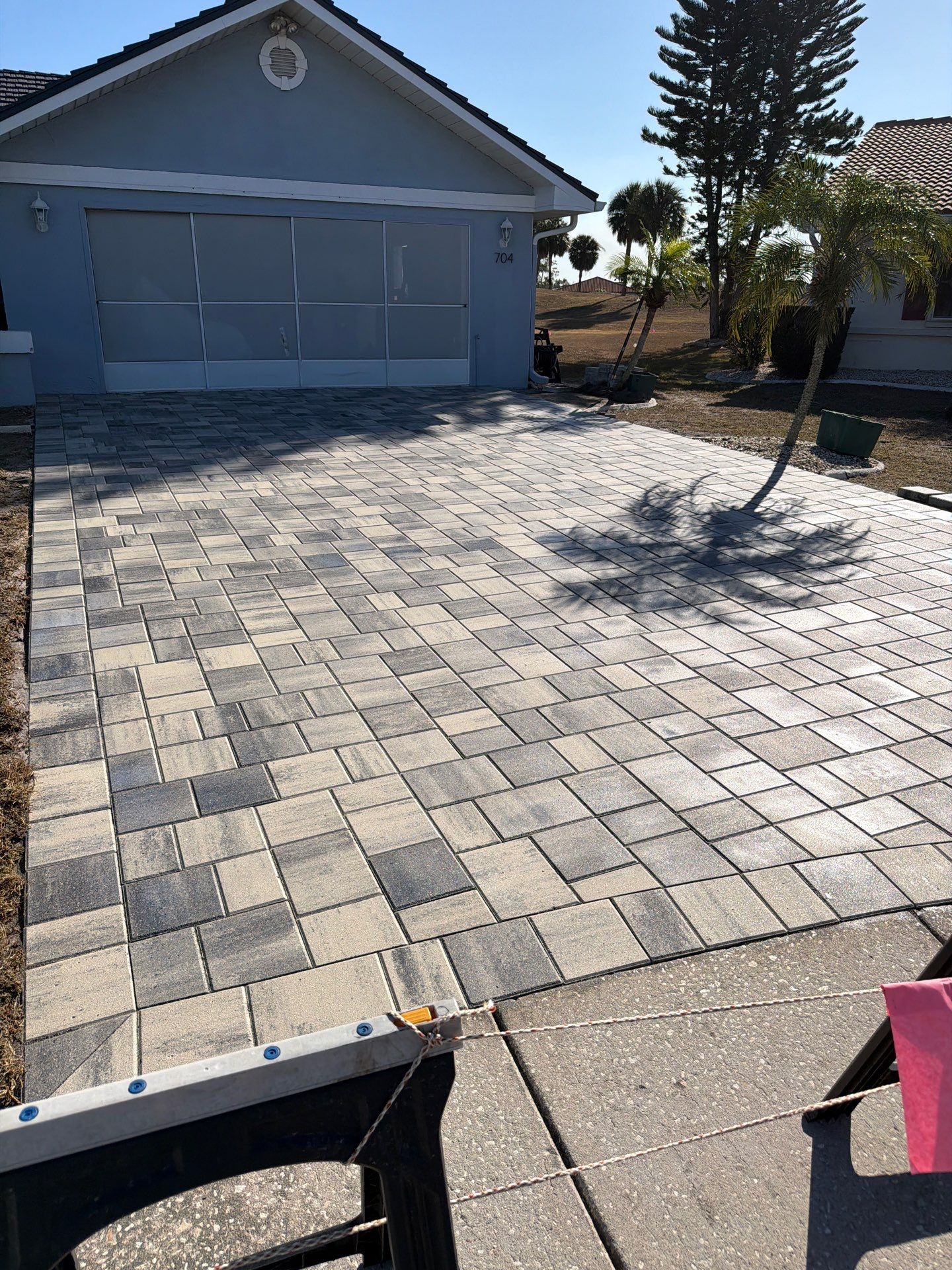 Multi-Tone Gray Paver Driveway Sealing in Sun City Center by Supreme Paver Experts