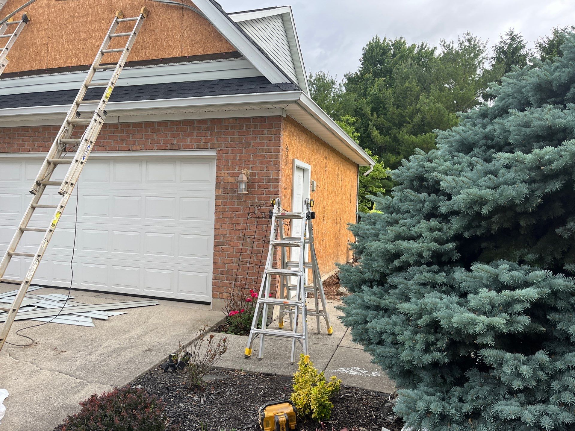 Exterior Installation using Onyx Black Durations and White Siding by WIW Enterprises Inc
