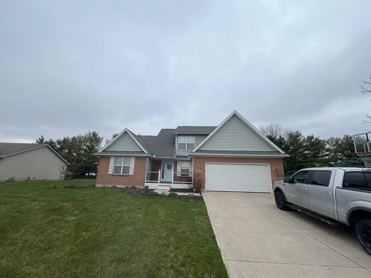 Exterior Installation using Onyx Black Durations and White Siding by WIW Enterprises Inc