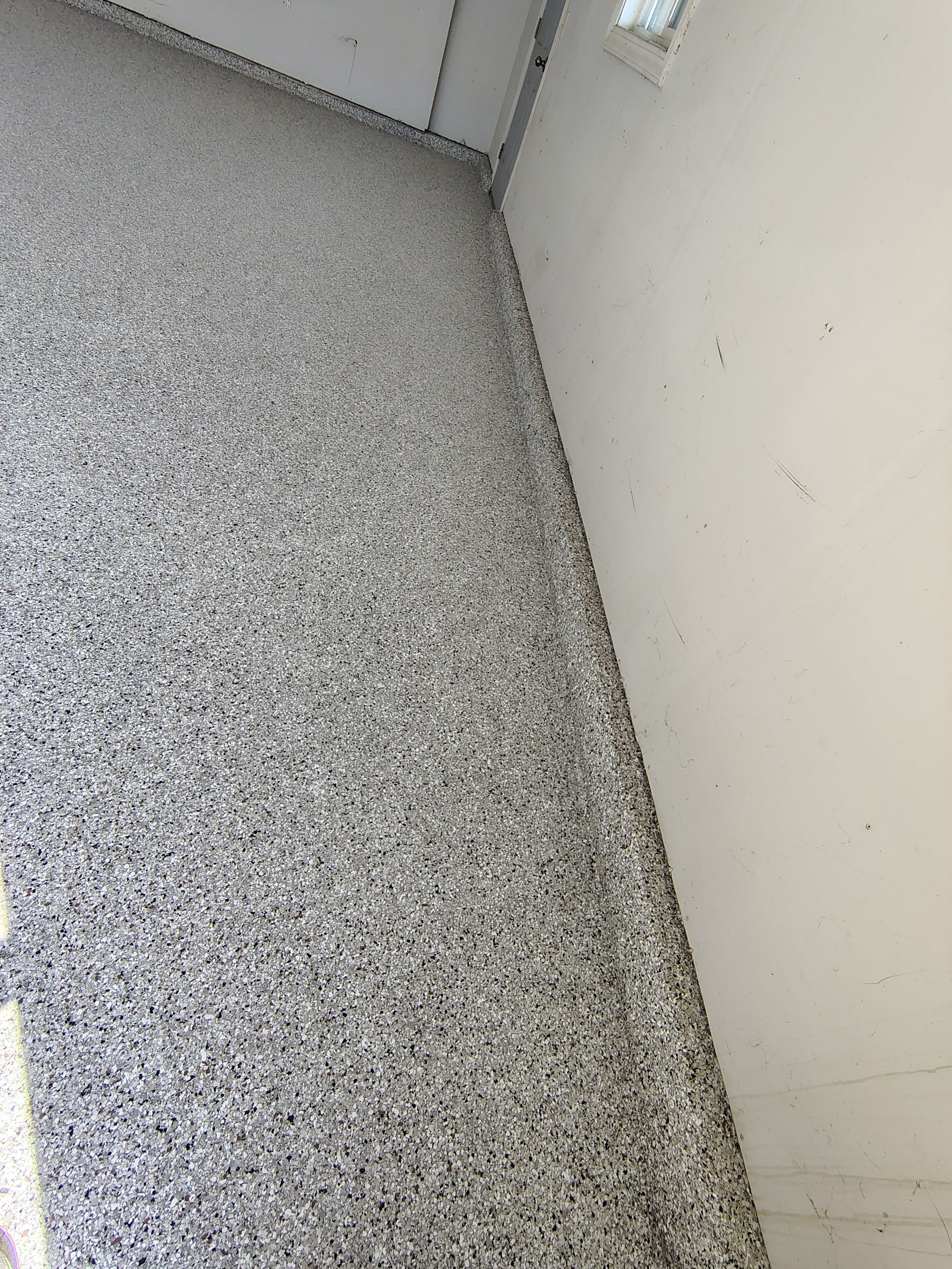 Decorative Chip Epoxy Garage Floor Coating in Sioux Falls by Select Painting, Coatings & Garage Cabinets