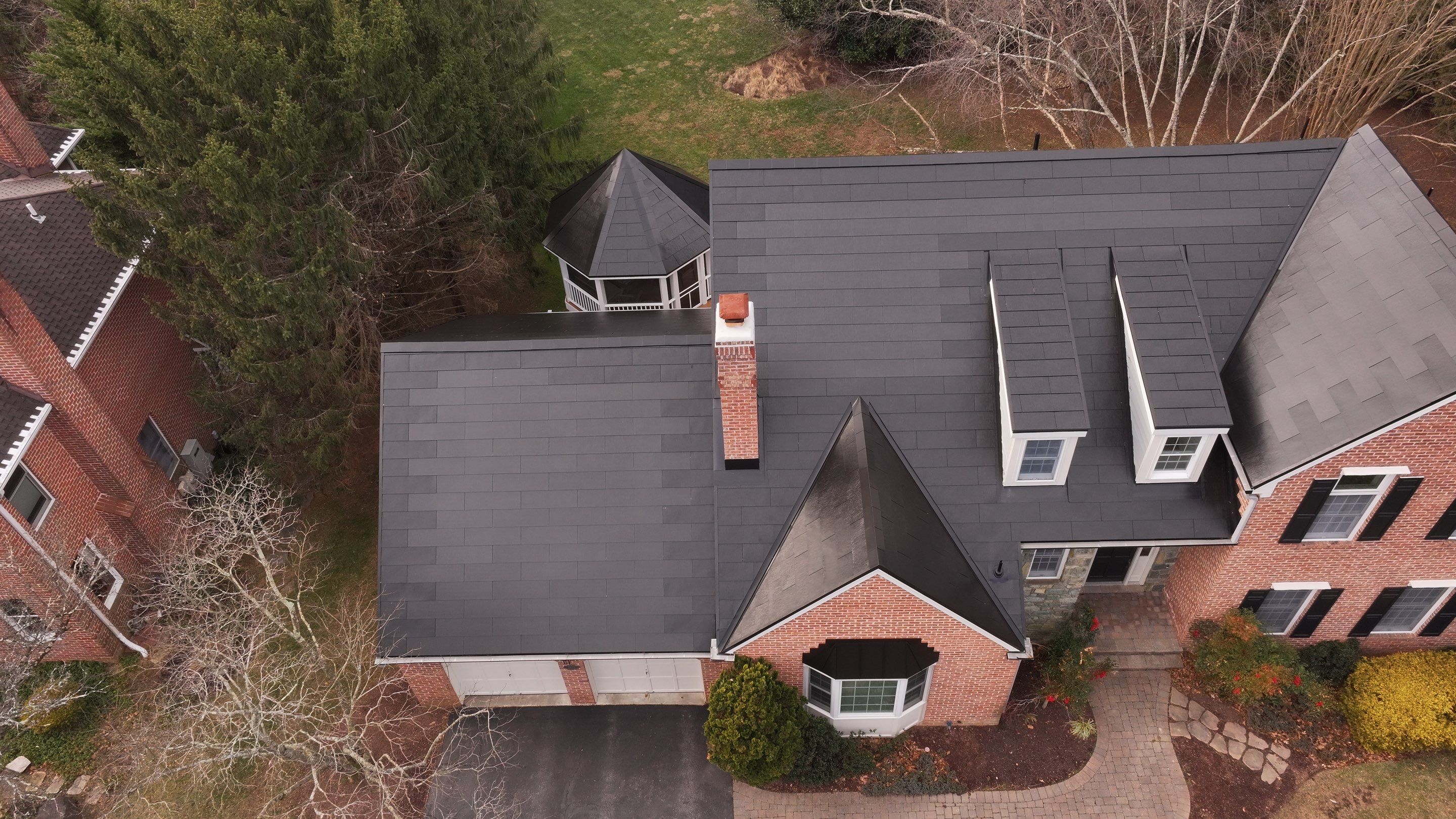 Sleek Tesla Solar Roof Installation by American Home Contractors