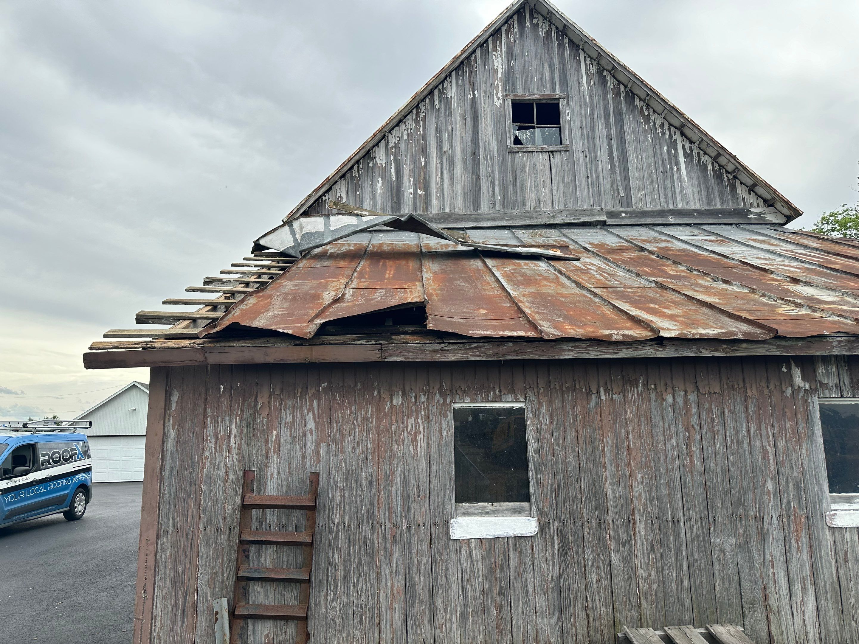 Residential Roofing Installation using Standing Seam Metal - Barn Red by RoofX 