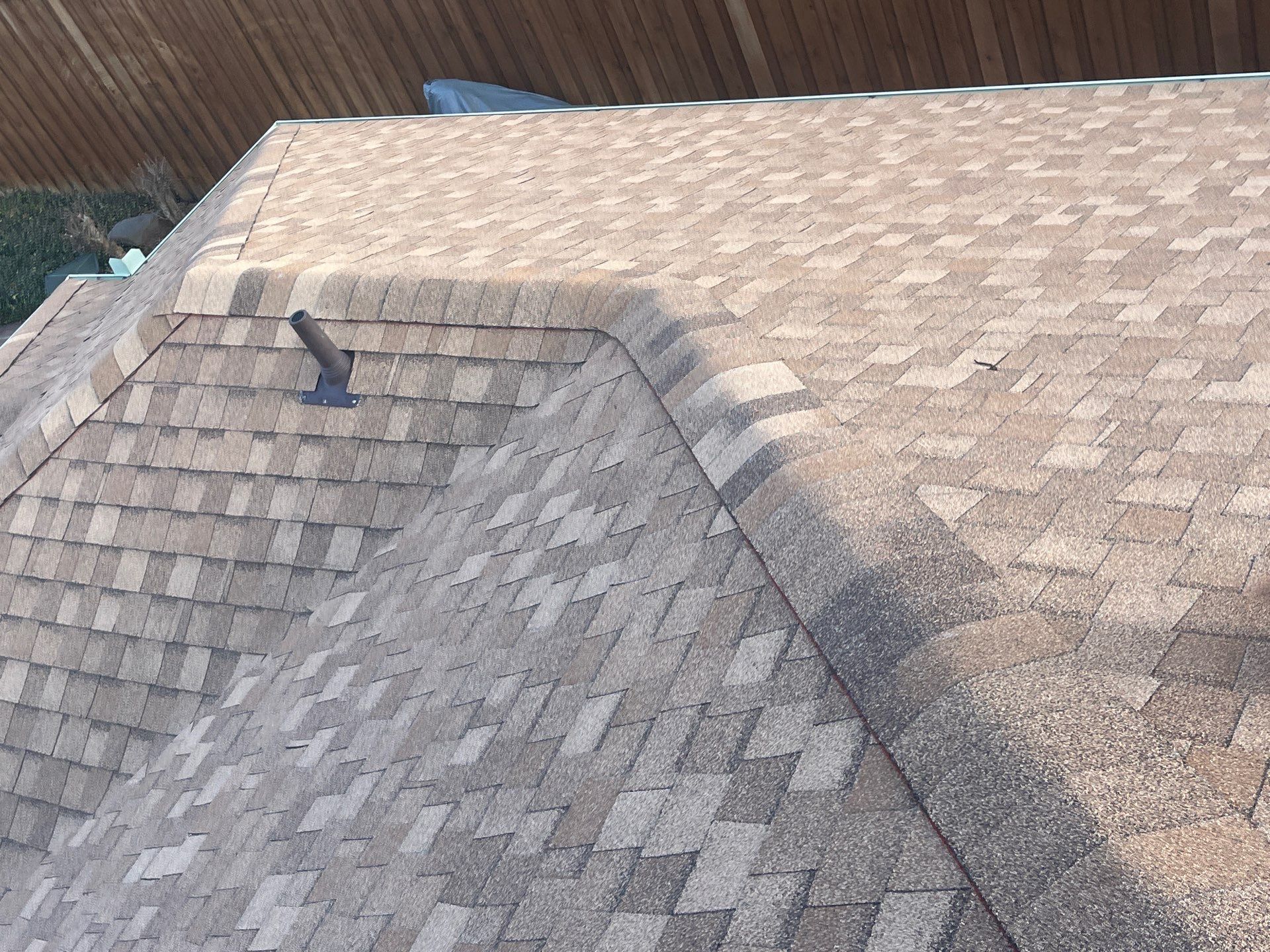 Medium brown brick with Tamko Rustic Cedar by Tejas Roofworks + Restoration