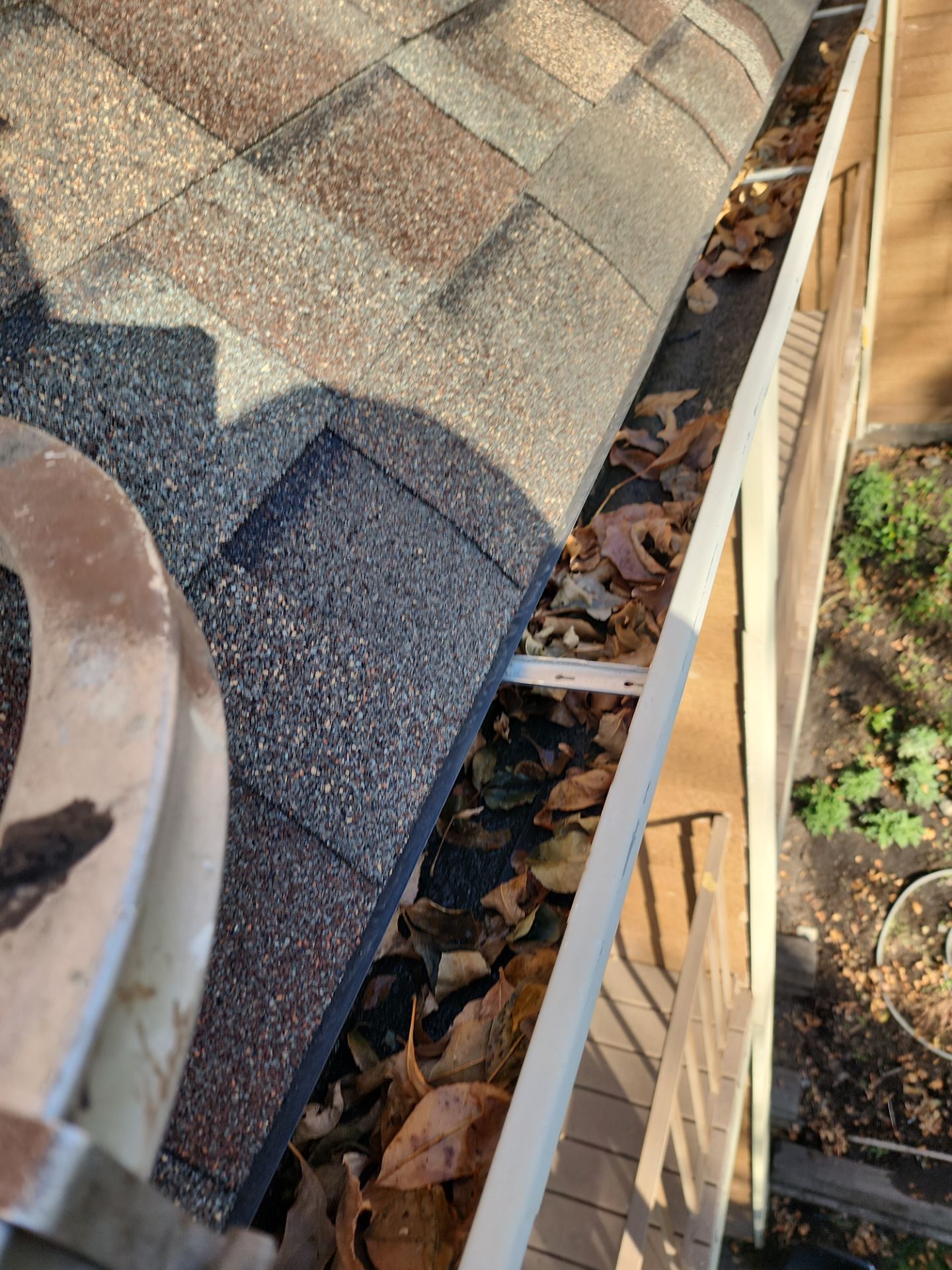 Commercial gutter cleaning Montana before photo with filled gutters