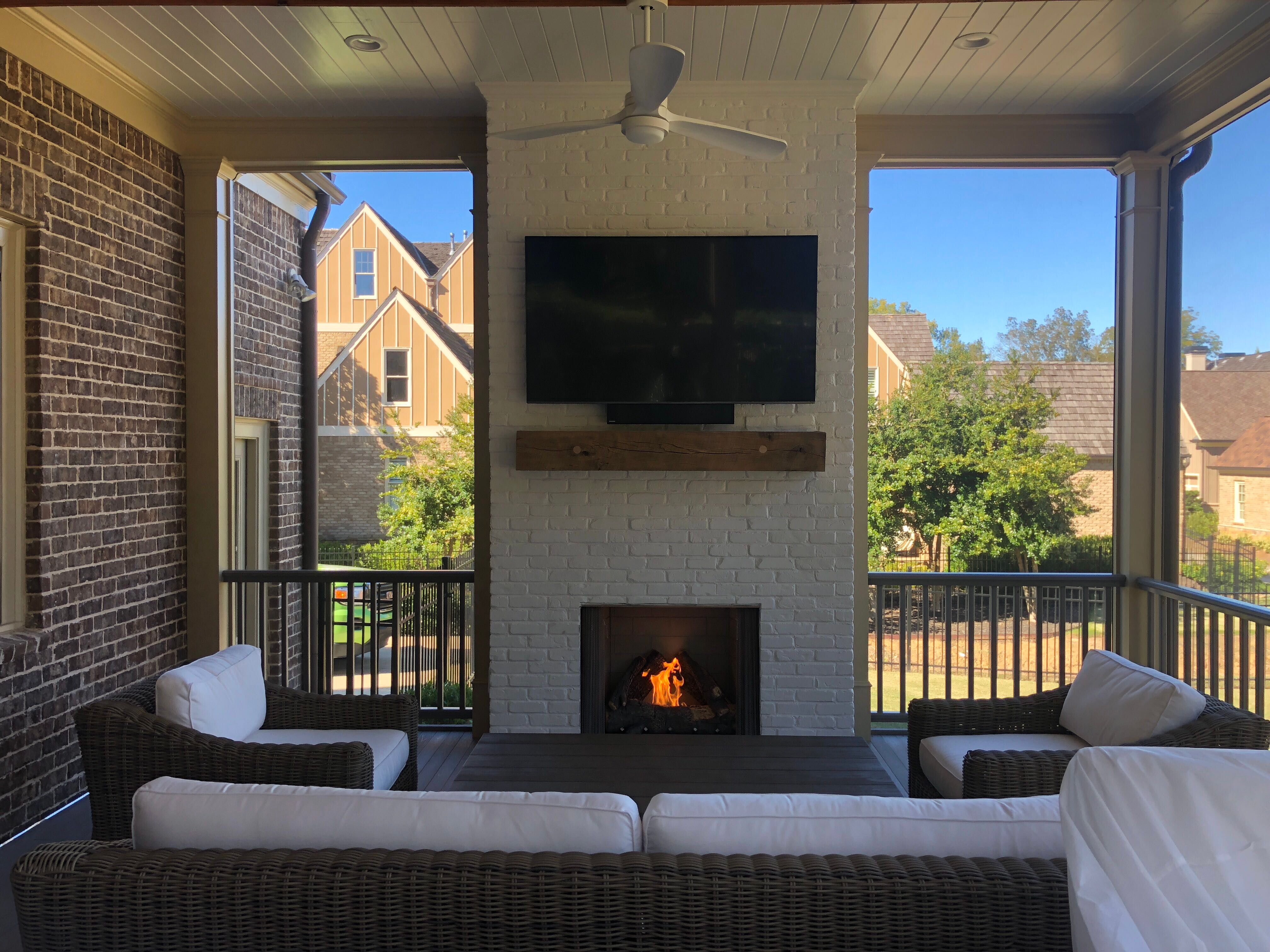 Custom Screened Porch Addition with White Brick Fireplace in Duluth by Swift Home Renovations