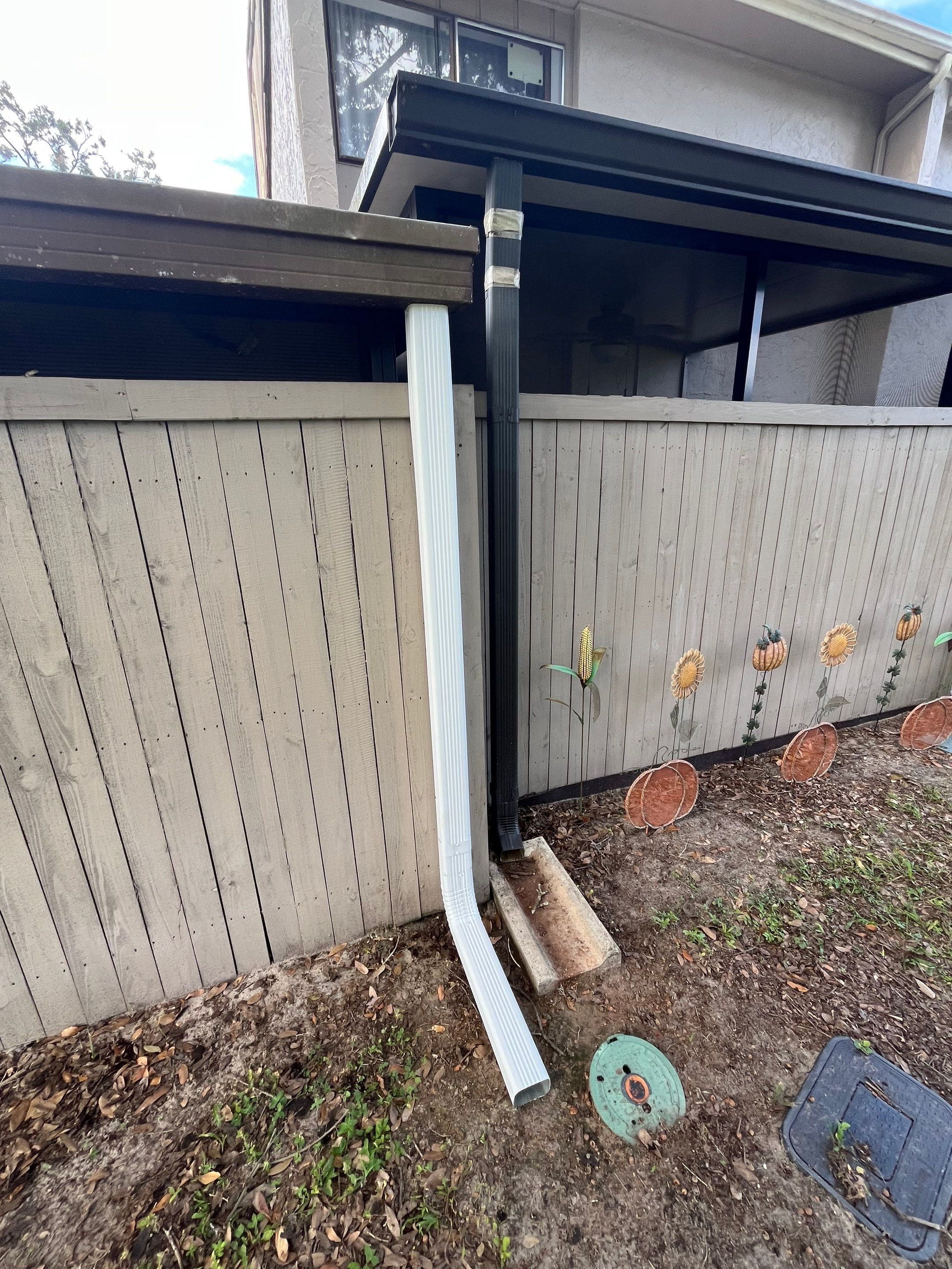 Professional Downspout Installation in Tampa, FL by Gutter Professor by Gutter Professors