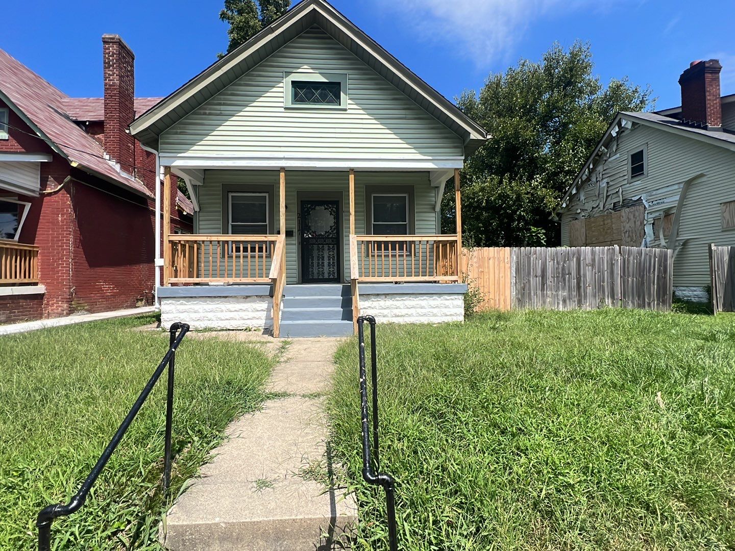 Rental Property Restoration, siding, flooring, gutters, landscaping by Storm Contracting 