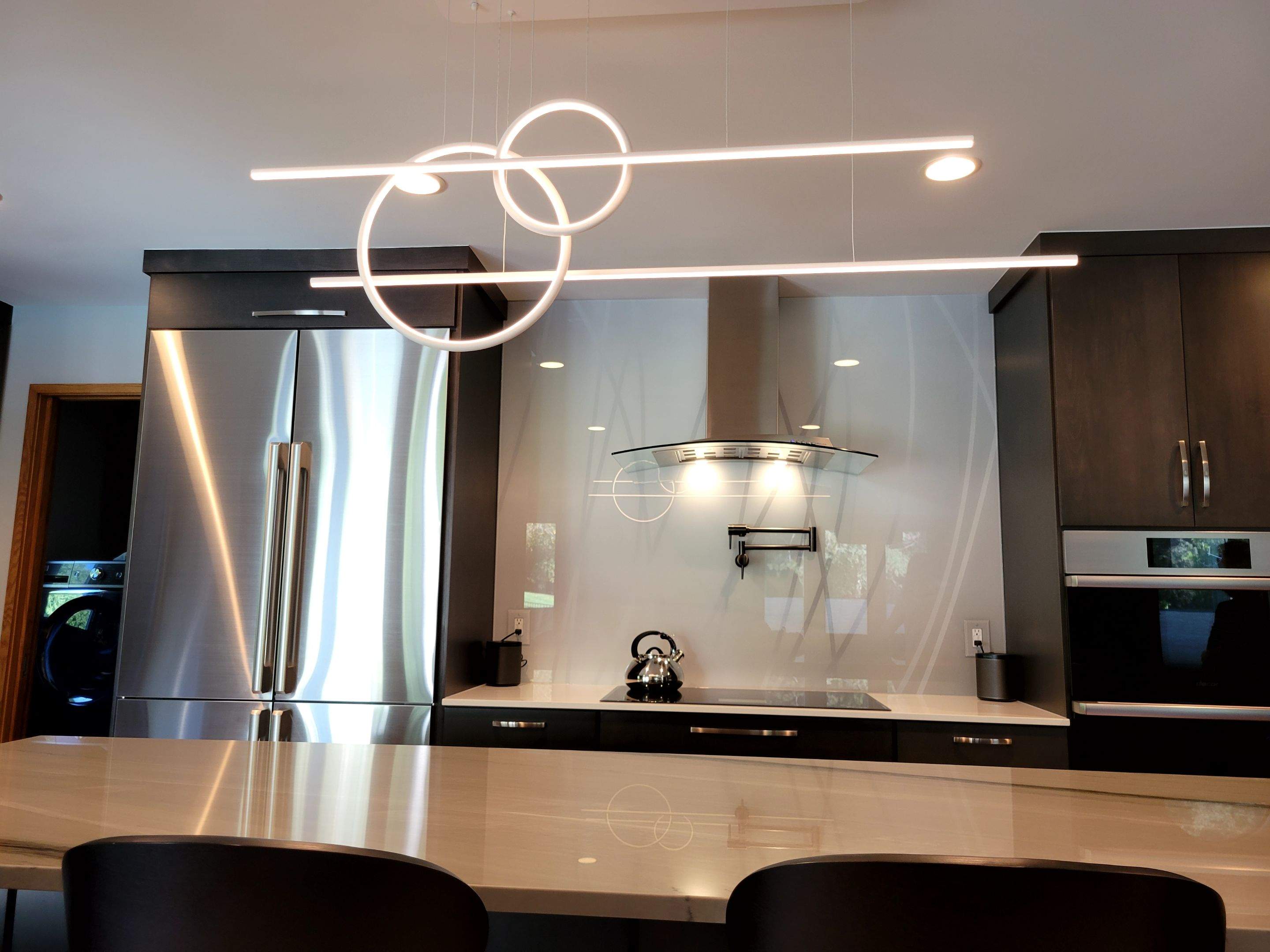 Kitchen Remodel using IMAGIO Misty Curves Solid Glass Backsplash by IMAGIO