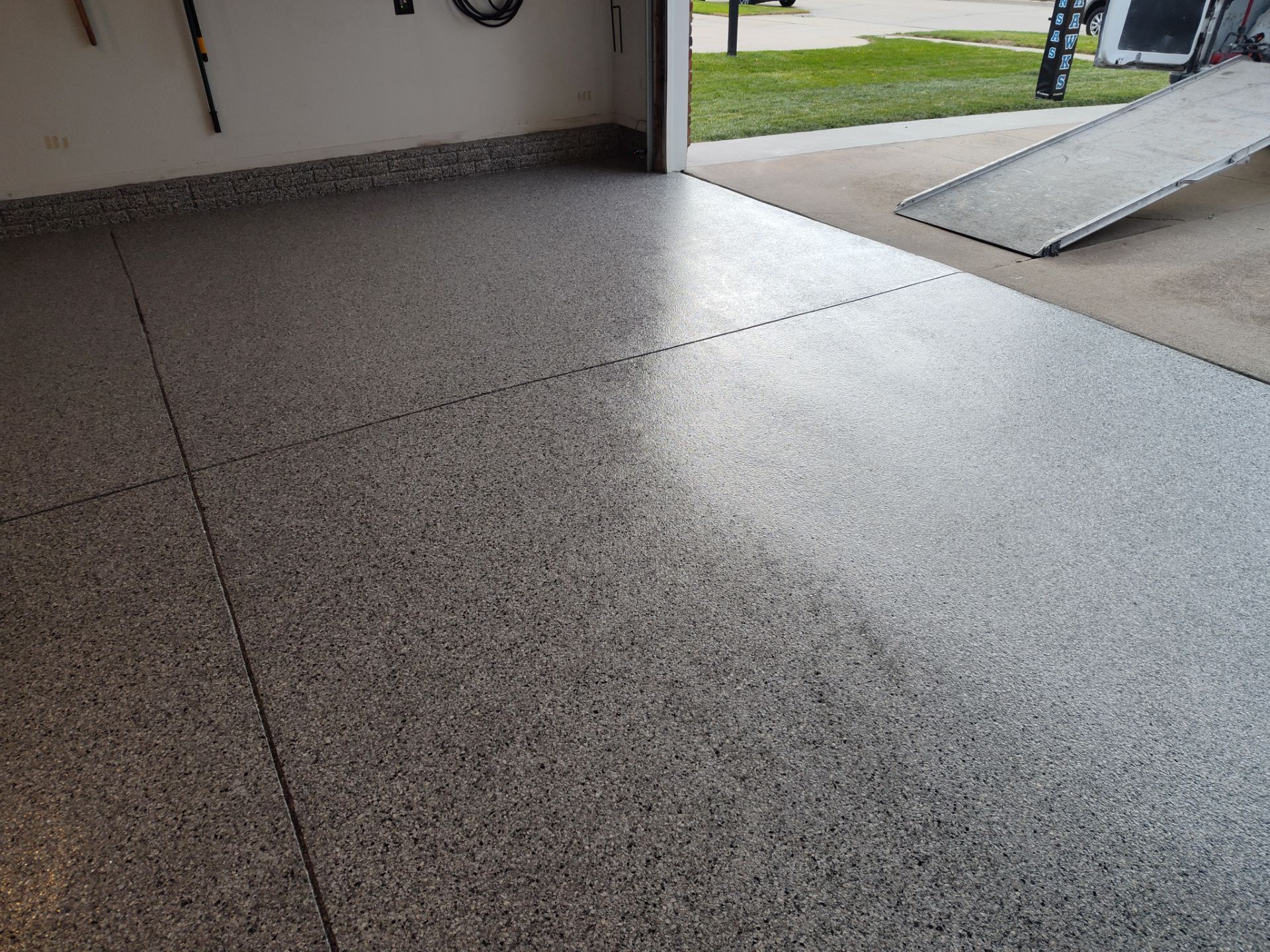 A Garage In One Day Keeps the Rock Salt Away! by Revival Concrete Coatings, LLC