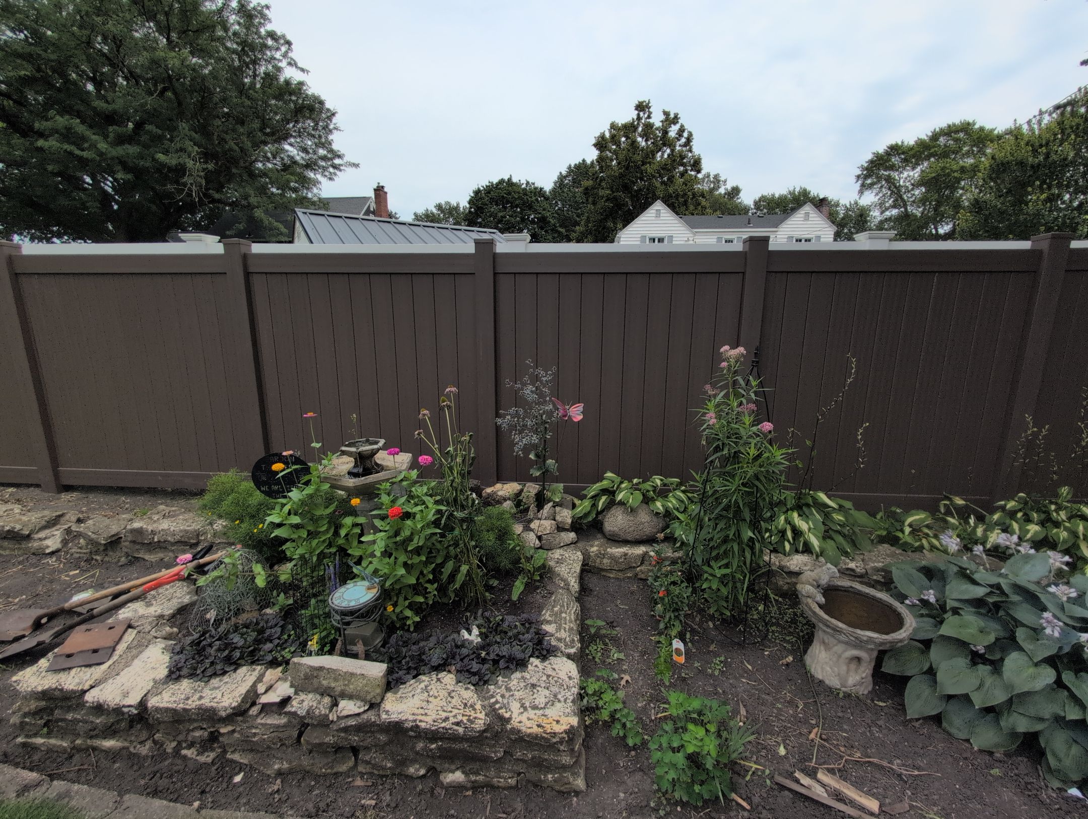 Walnut Vinyl Privacy Fence Installation in Waterloo by Perfect Picket Fence and Stain
