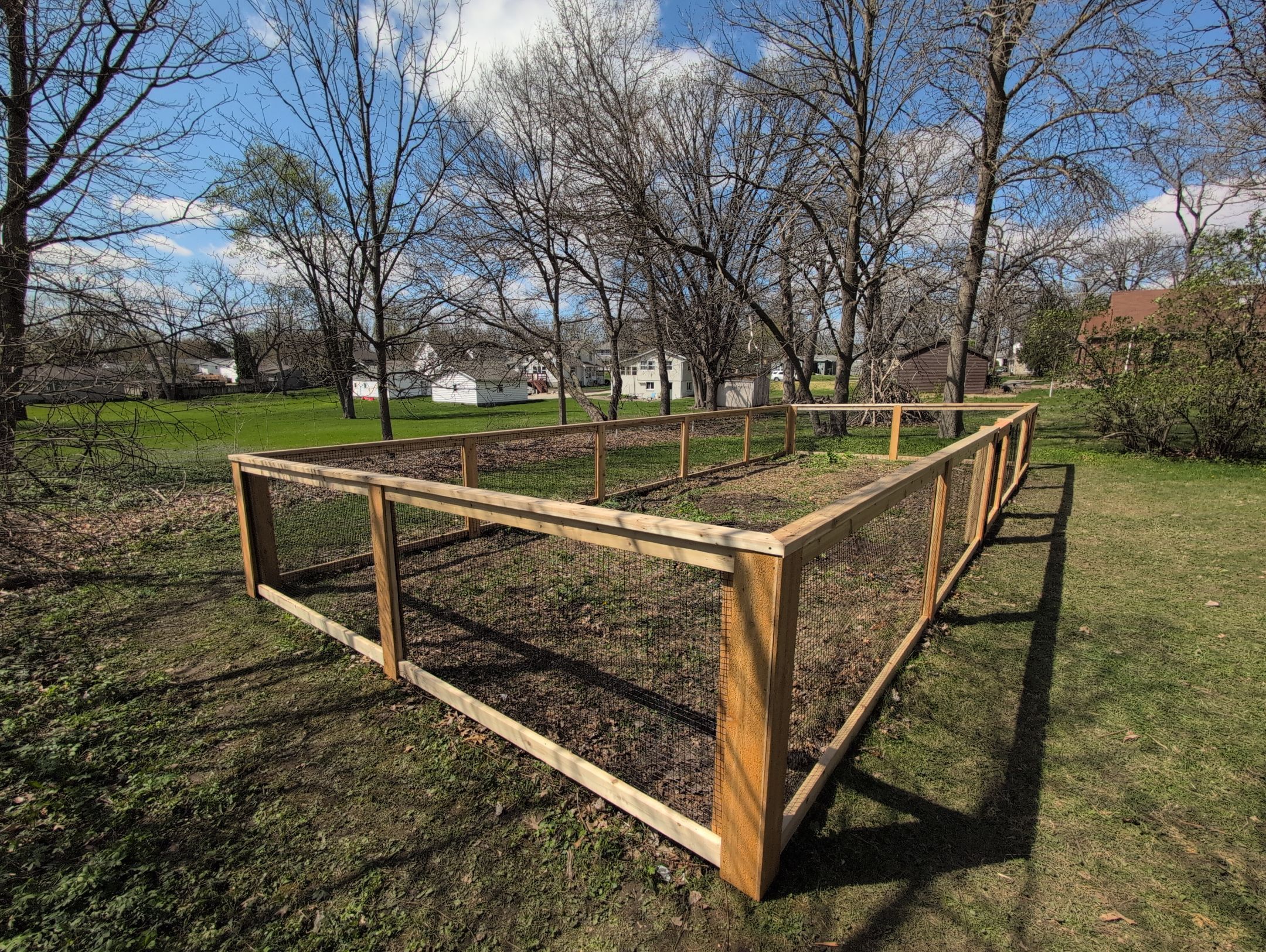 Custom Cedar Wood Garden Fence Installation in Cedar Falls by Perfect Picket Fence and Stain