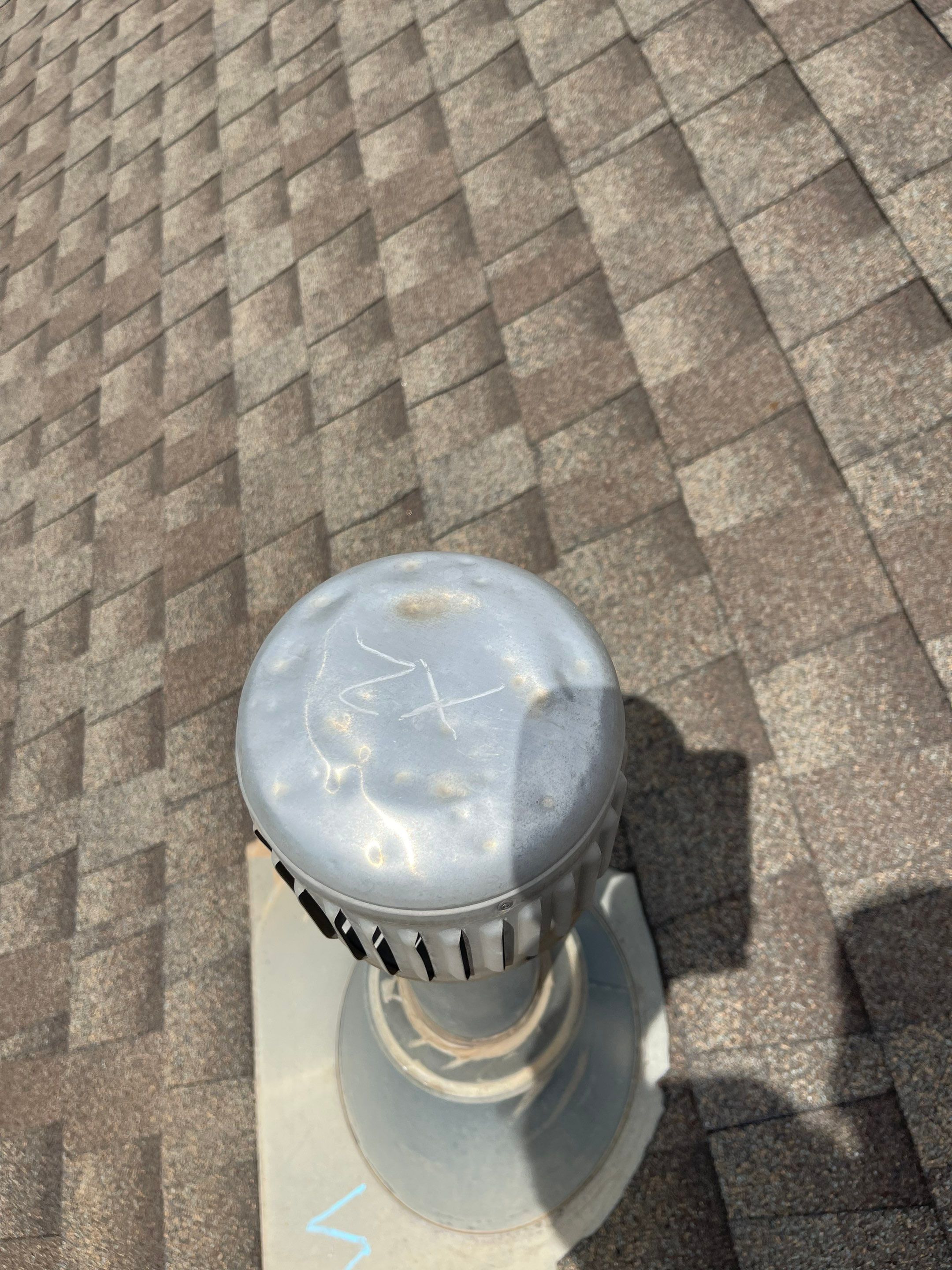 Hail Damage on a Roofing System by Icon Roofing And Construction 