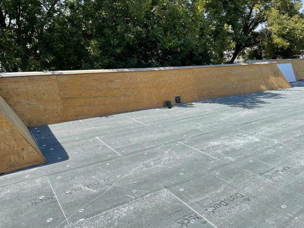 Commercial Roofing Installation using General Coatings acrylic coatings and spray foam by Straight Edge Roofing Inc