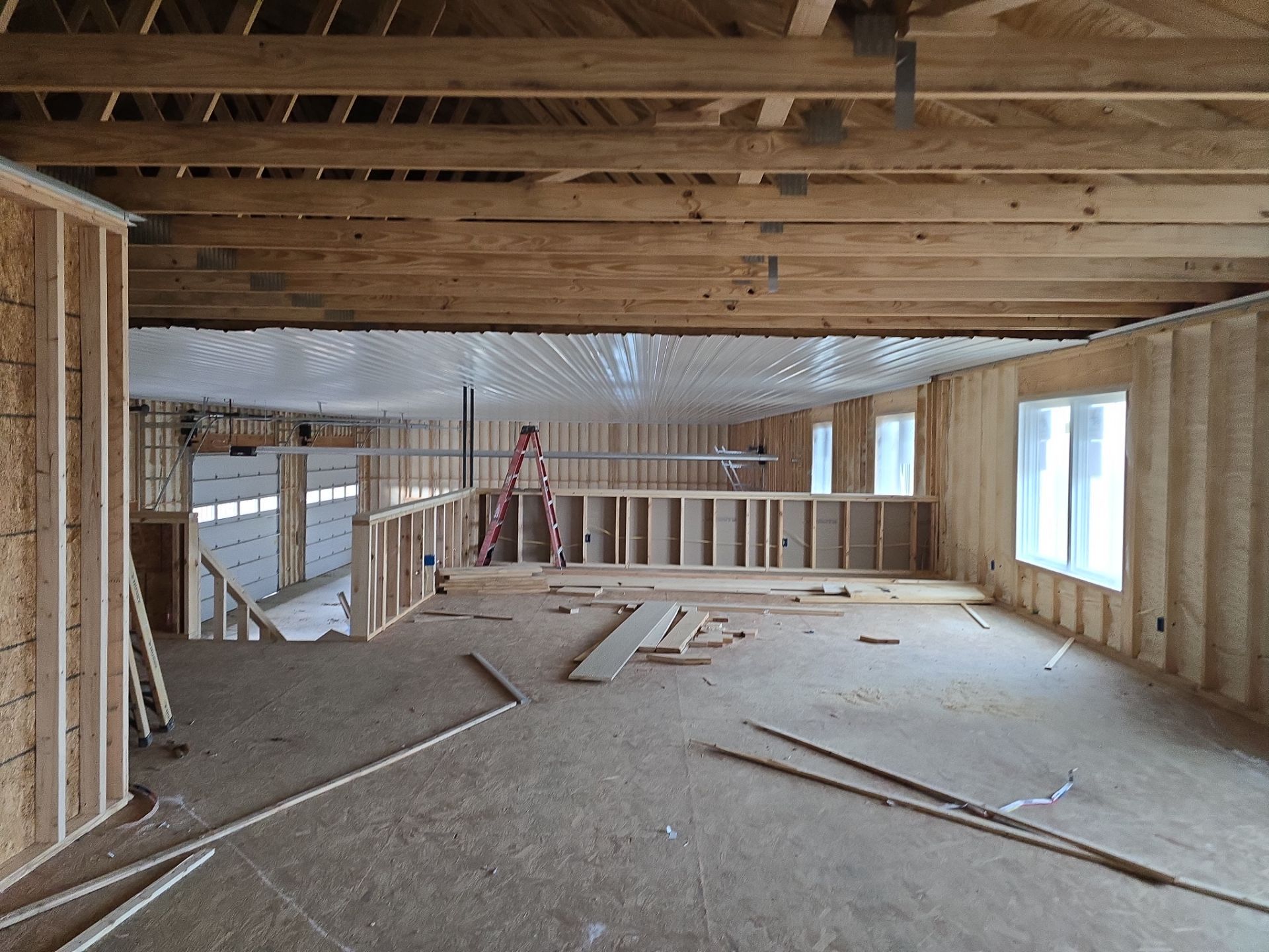 New Home construction w/ board and batten sides and metal roof  by Miles Construction 