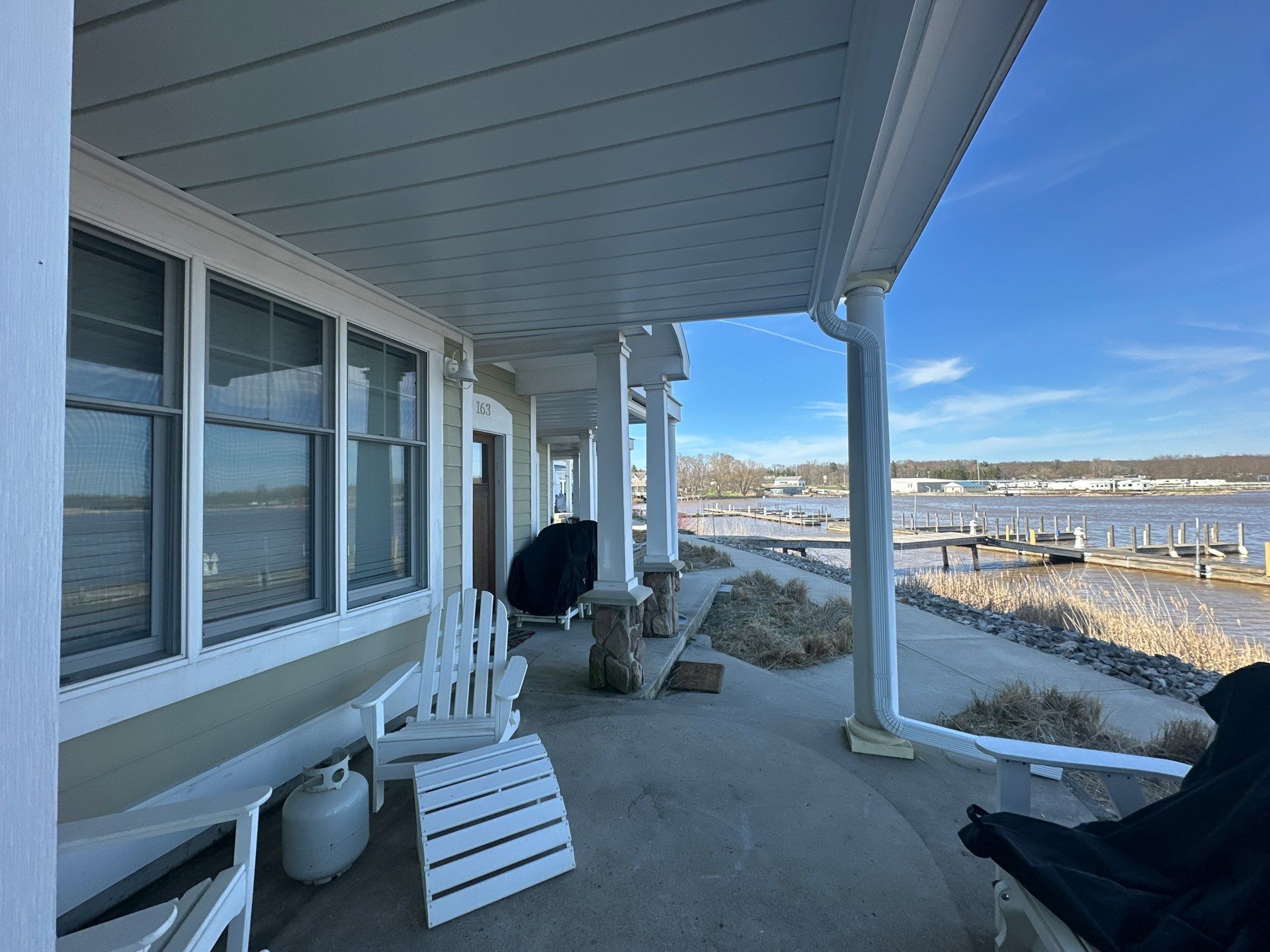 Waterfront Underdeck System Installation and Covered Patio in Manistee by Rainbow Seamless Systems