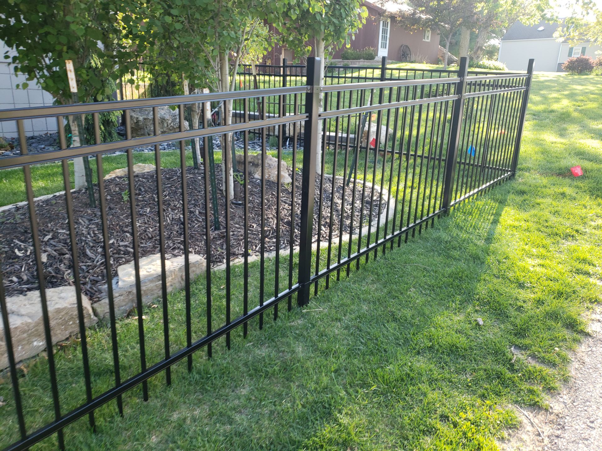 Ornamental Black Metal Picket Fence Installation in Cedar Falls by Perfect Picket Fence and Stain