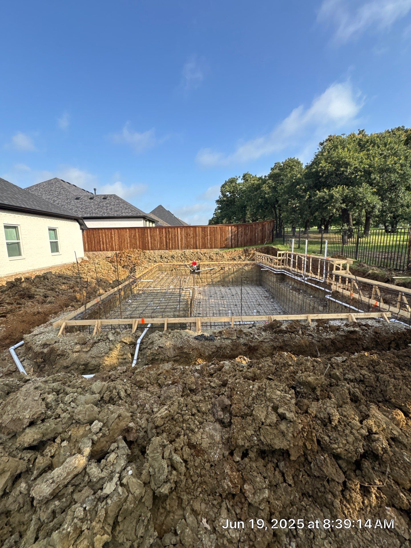 Geometric Pool with Stacked Stone Water Wall by Pinnacle Pools and Spas - DFW
