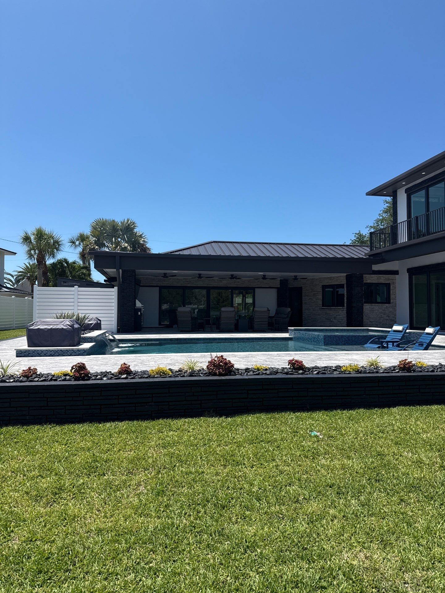 7-Inch Smooth Box Seamless Gutters using black seamless gutters in Siesta Key Fl by Gutter Professors
