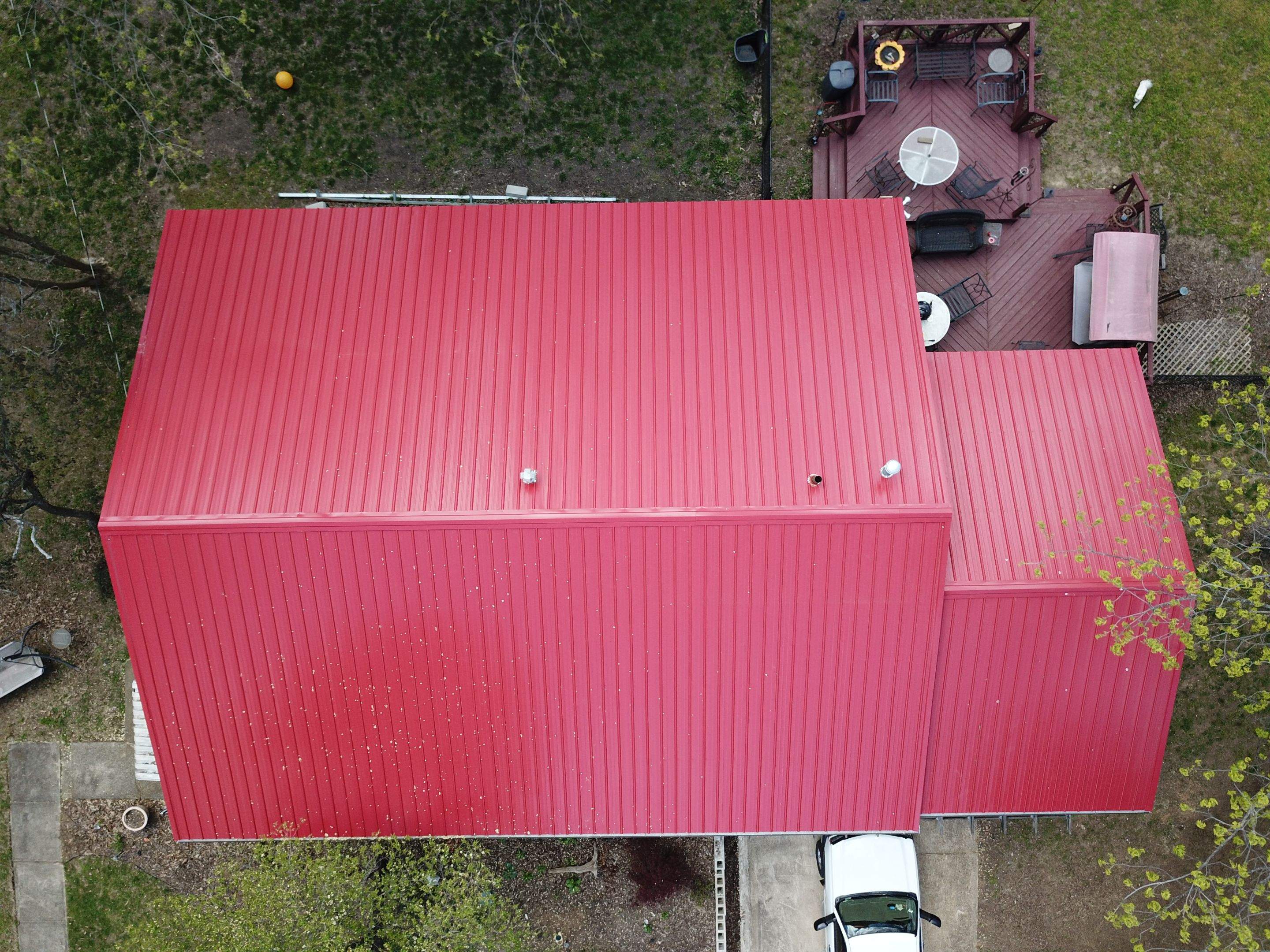 Residential Roofing Installation using 26 Gauge Colored Panels by Hostetler Roofing