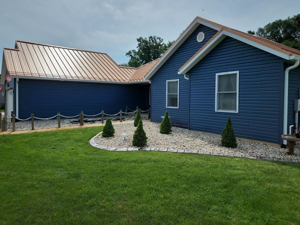 Residential Roofing and Siding Installation using Copper Penny Standing Seam by 4Ever Metal Roofing