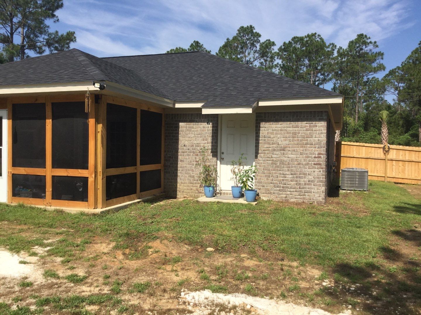 Downspout Installation using White Down Spouts in Milton FL by Gutter Professors