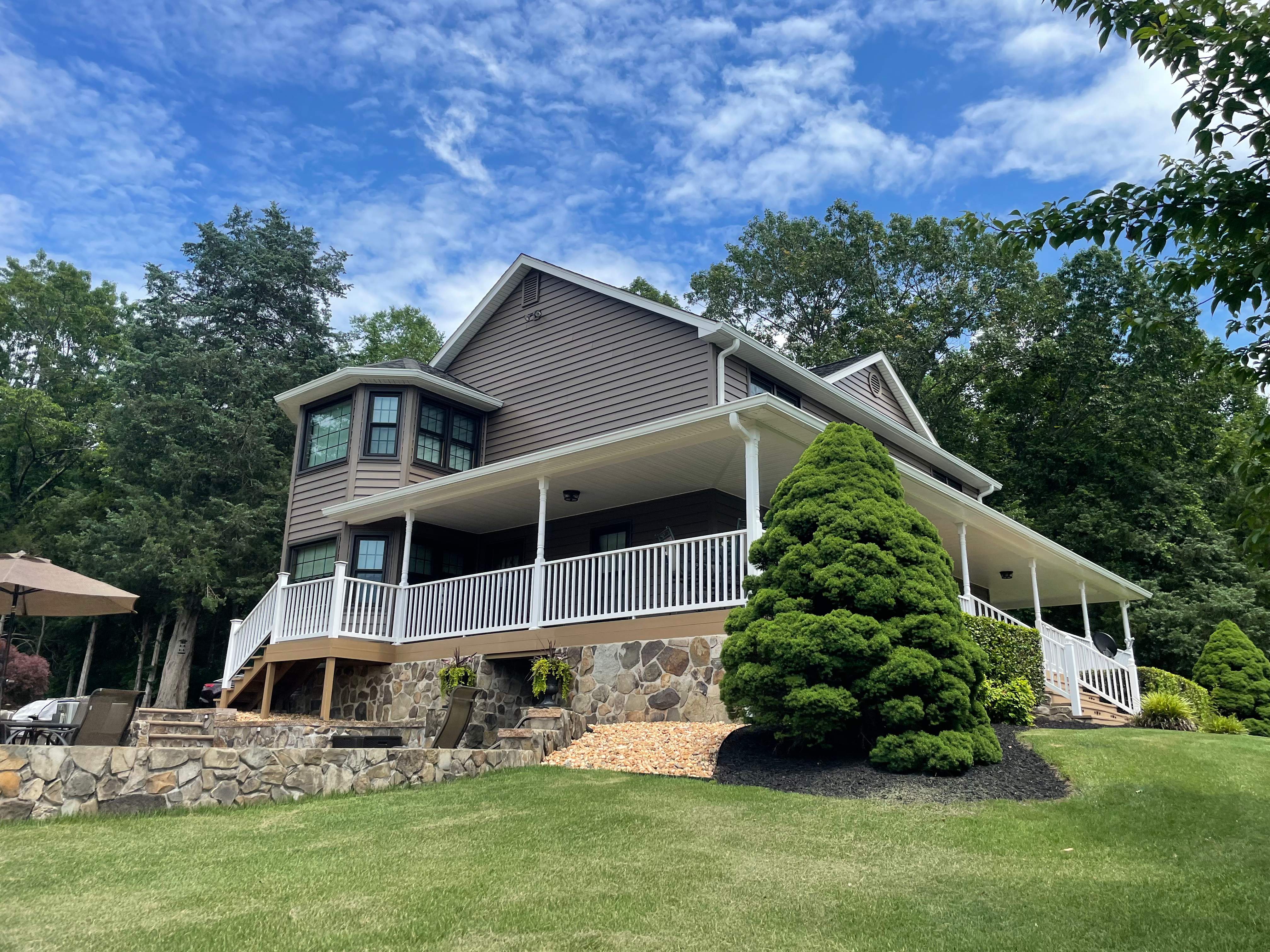 Exterior remodel including window replacement by American Home Contractors