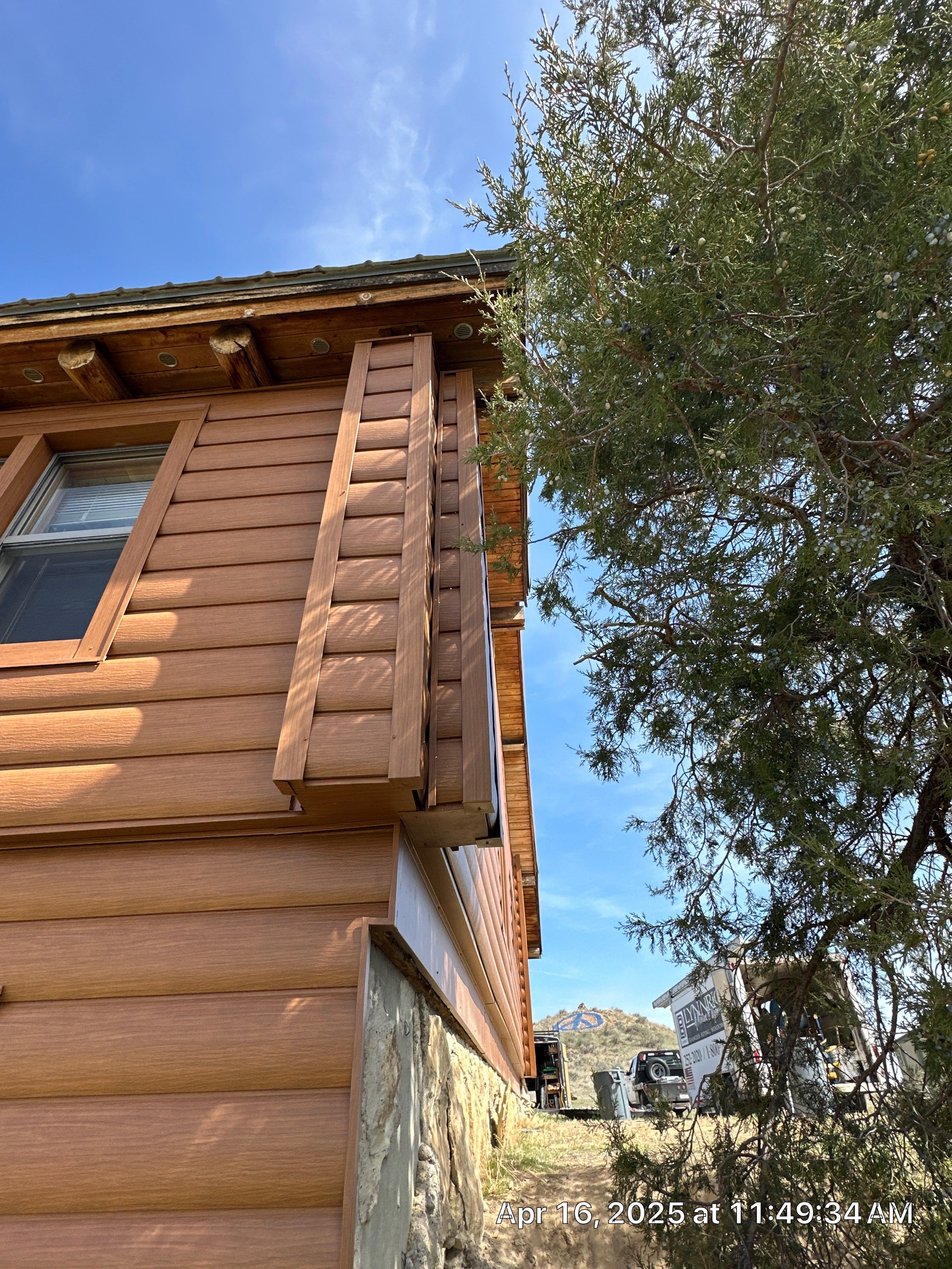 Siding Installation using Log Siding by Lynnrich Seamless Siding, Windows & Doors