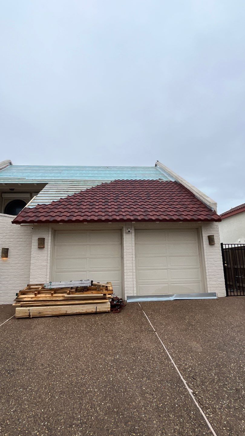 Off with the Tile and on with the TILCOR stone coated metal.  by Bayfront Roofing and Construction