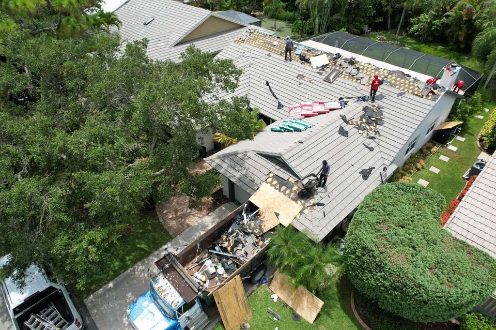 Standing Seam Metal Charcoal Grey Roof Replacement and Skylight Installation in Jupiter by Art's Roofing & Construction