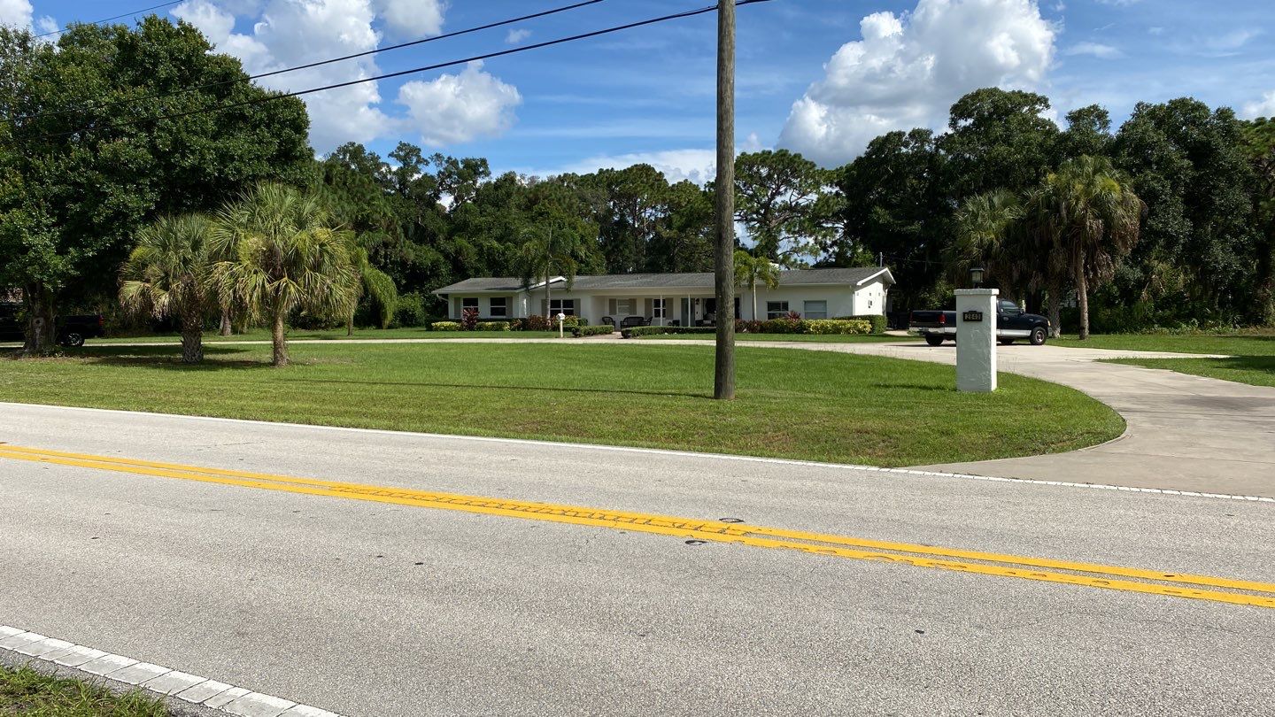 Sarasota, FL. Vinyl Fence Installation using Tan Vinyl Louvered Vinyl Fence by Asap fence and gates, LLC