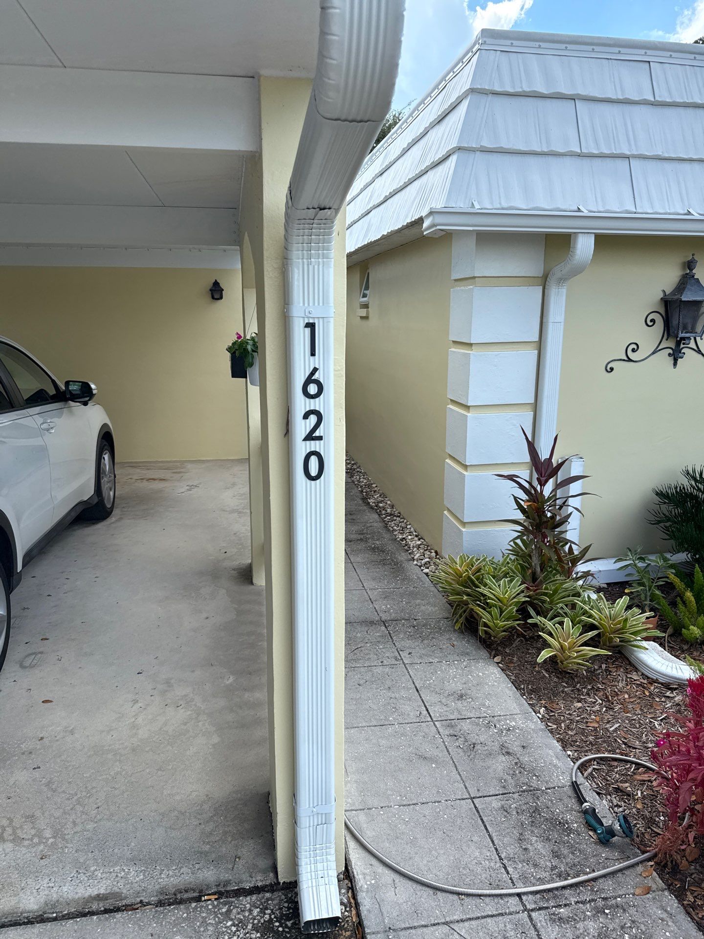 White Gutters and Matching Downspouts in Sarasota FL by Gutter Professors