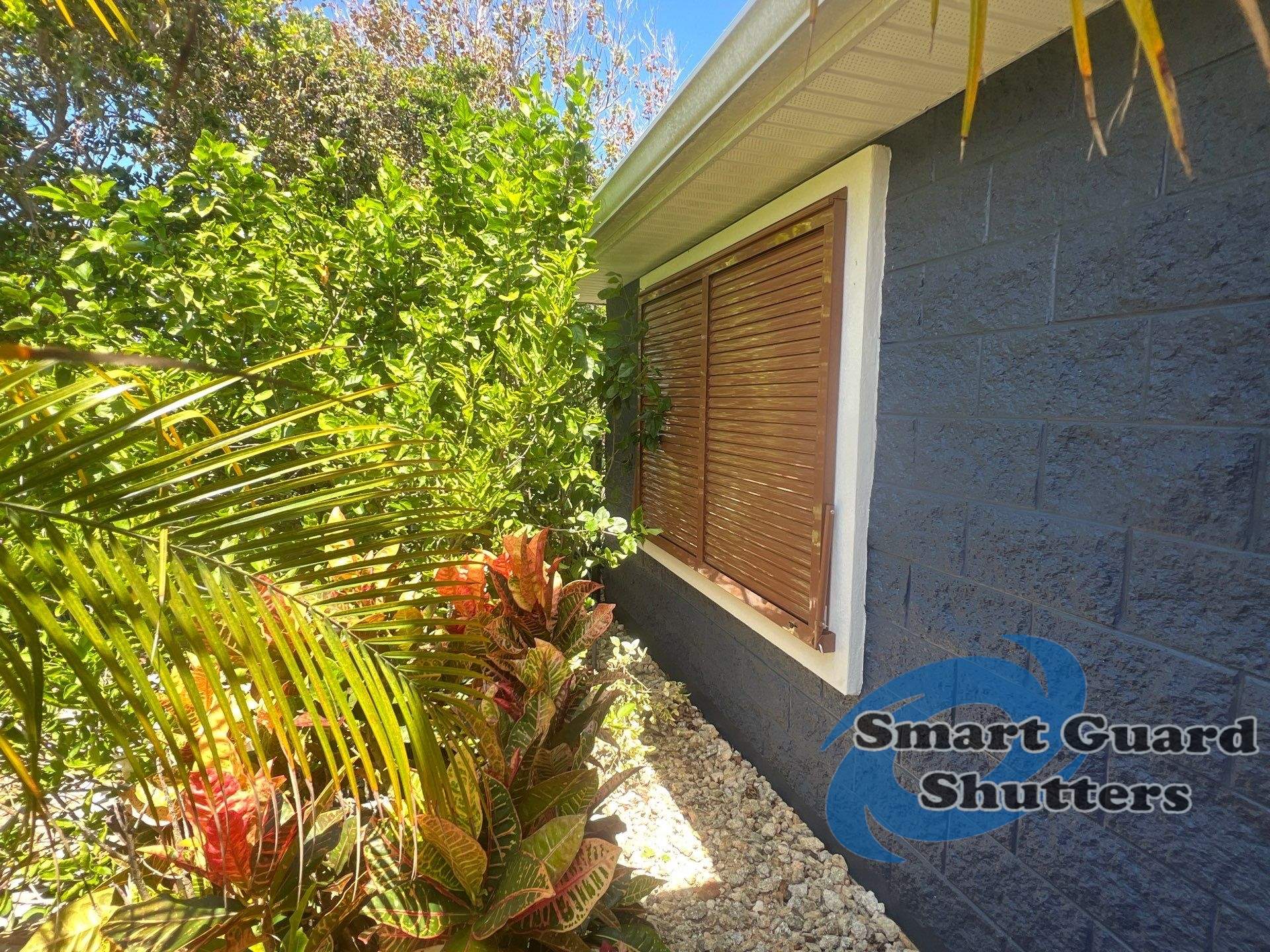 Impact Rated Bahama Shutters in Beige Brown by Smart Guard Shutters