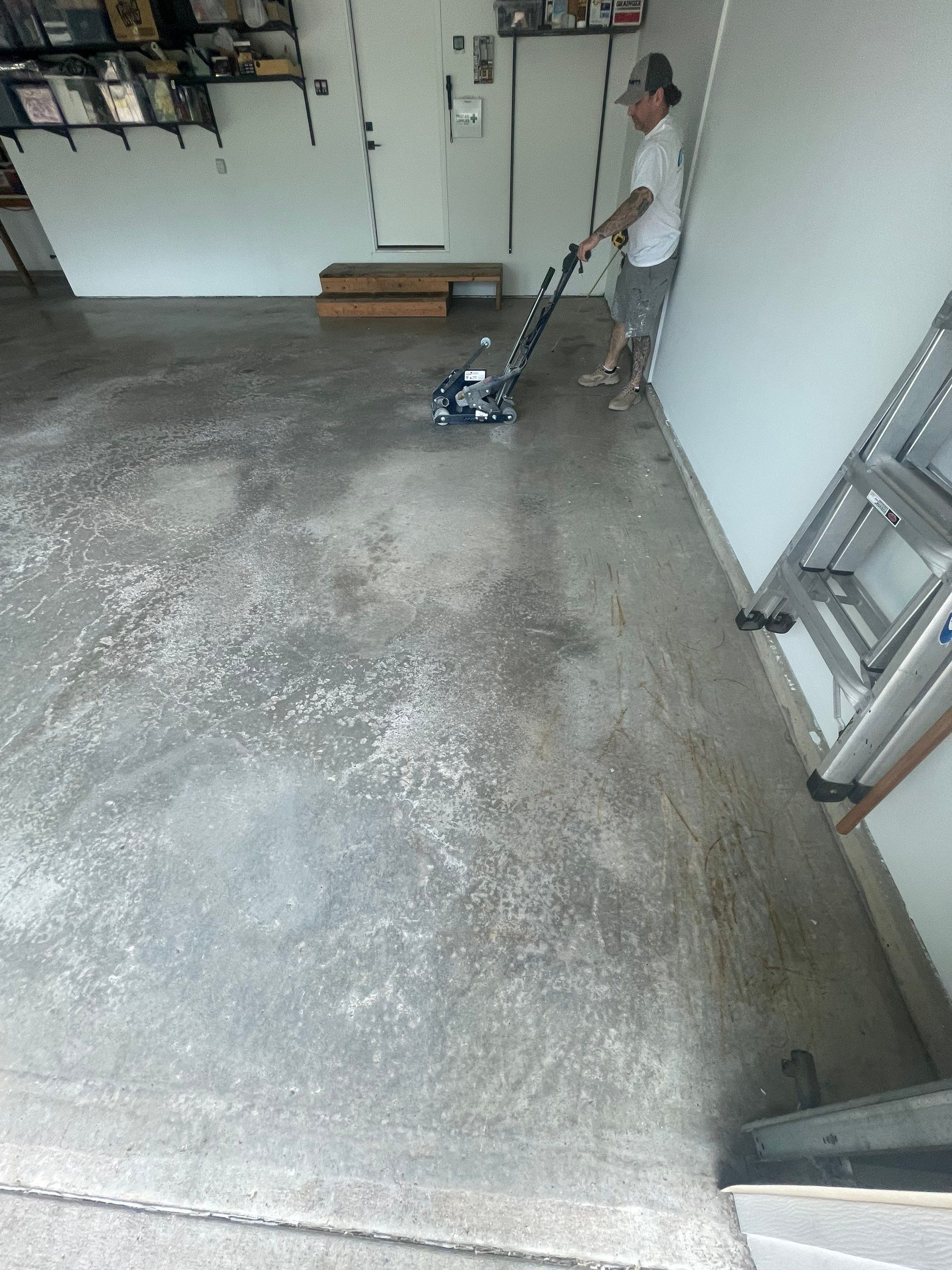 Feather Grey Garage Floor Coating Installation in Sioux Falls by Select Painting, Coatings & Garage Cabinets