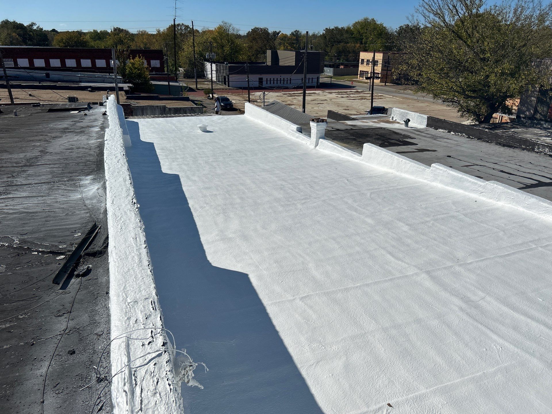Downtown Gladewater Commercial Foam Roof Restoration – SPF + High-Tensile Acrylic by All Star Roofing LLC