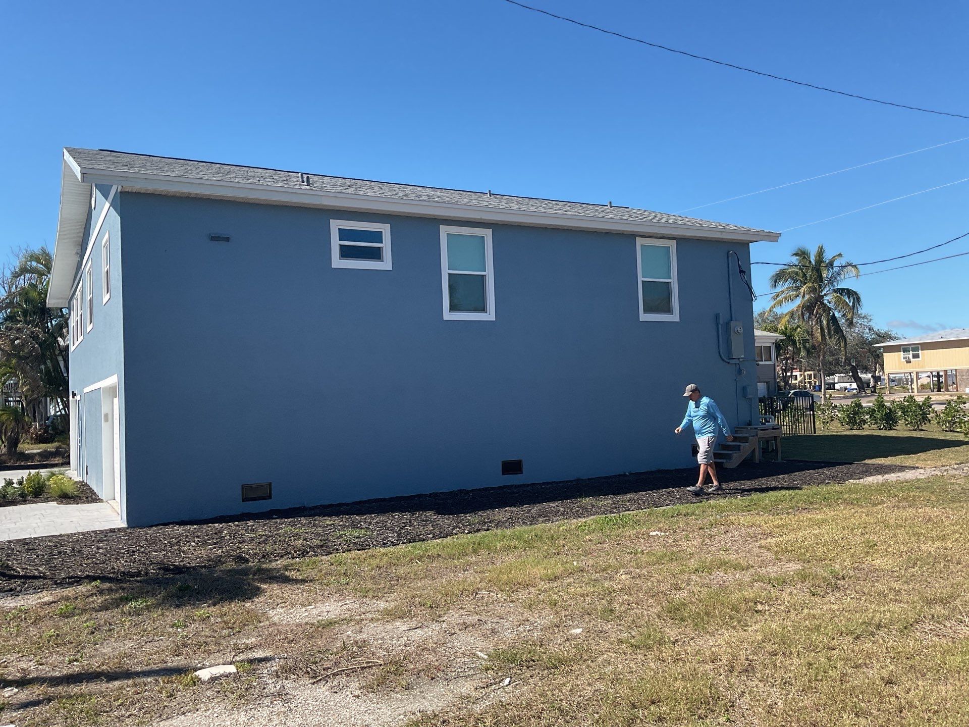 Downspout Installation for Two-Story Home in Fort Myers FL by Gutter Professor by Gutter Professors